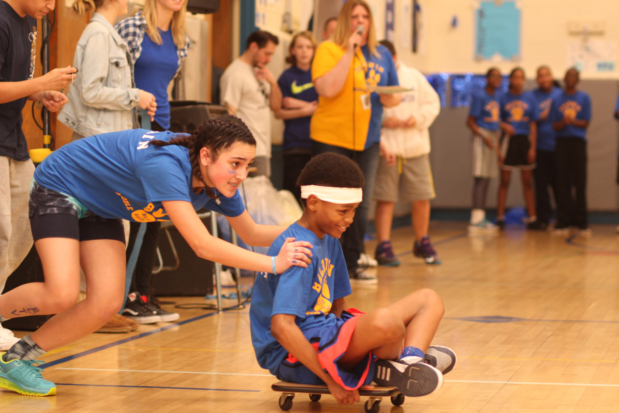 Blue Team captains Nicolette Manzella and Rhyjon Blackwell took a wide turn in the scooter relay.