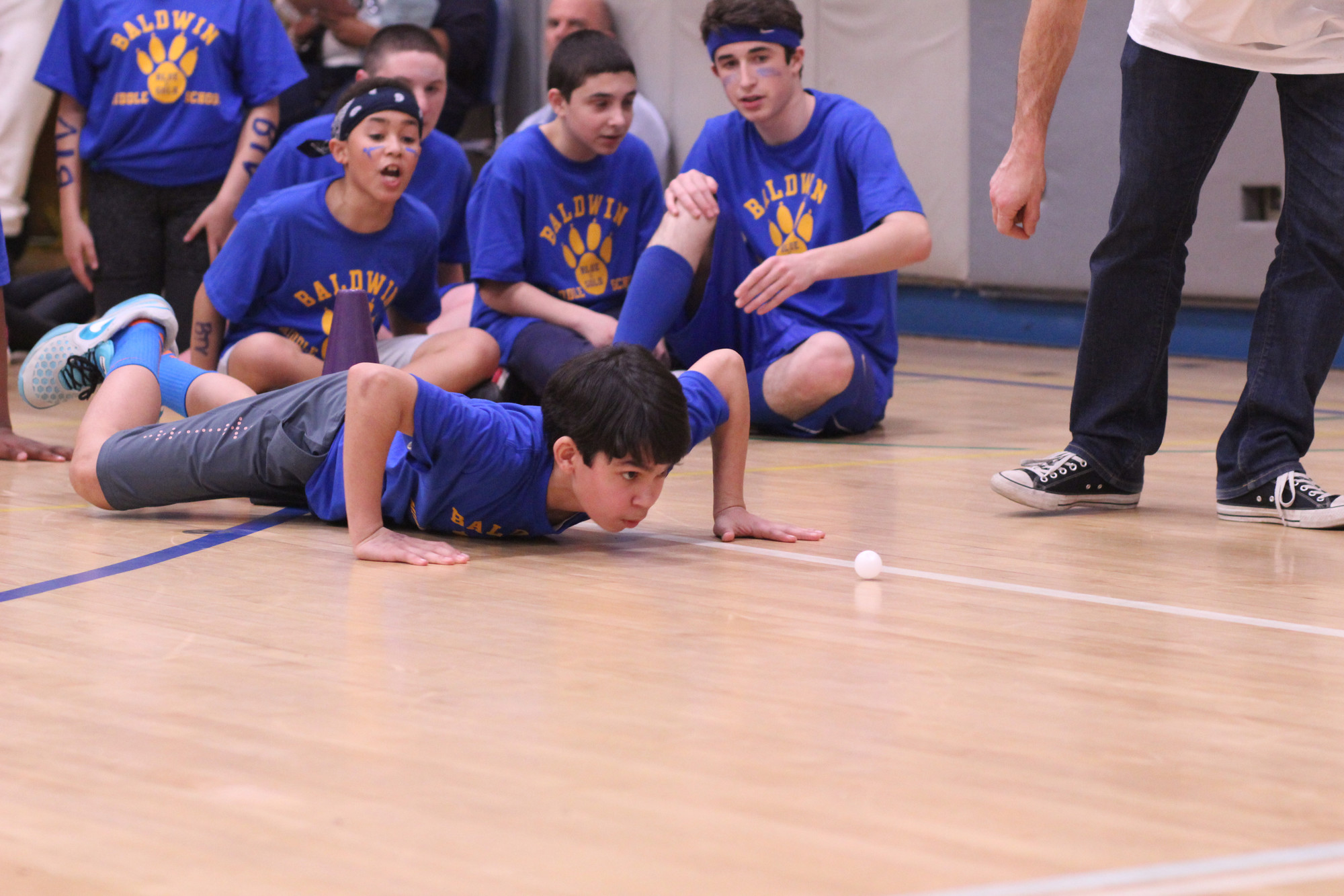 Justin McMackin was urged on by his teammates during the ping-pong relay.