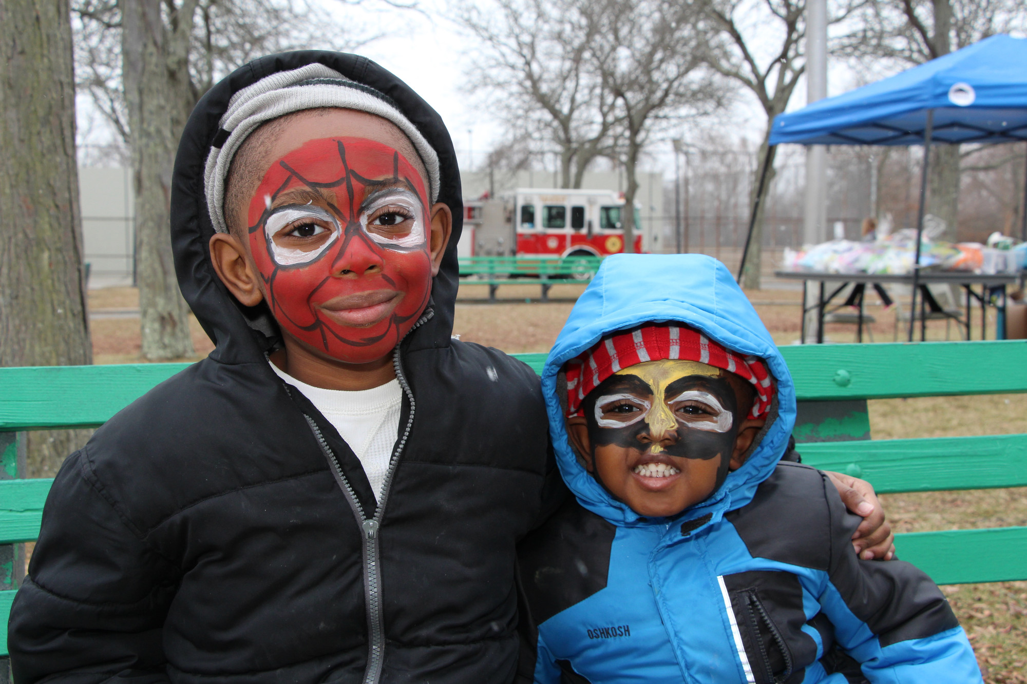 Nicholas Delva, 7, and his younger brother Brandon, 3, got their faces painted like some of their favorite super heroes.
