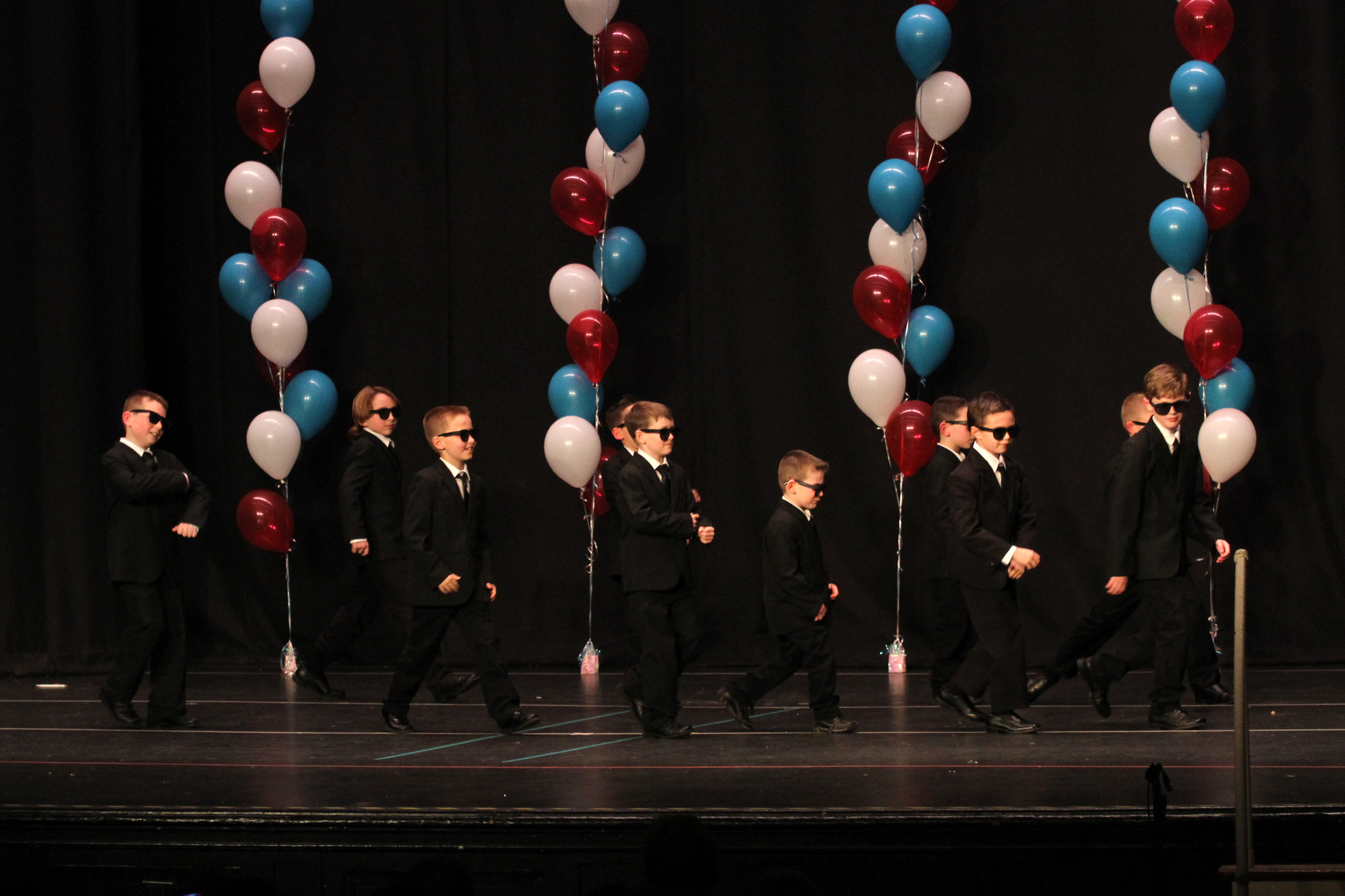 First and second grade boys put on sharp suits and danced to “Men in Black.”