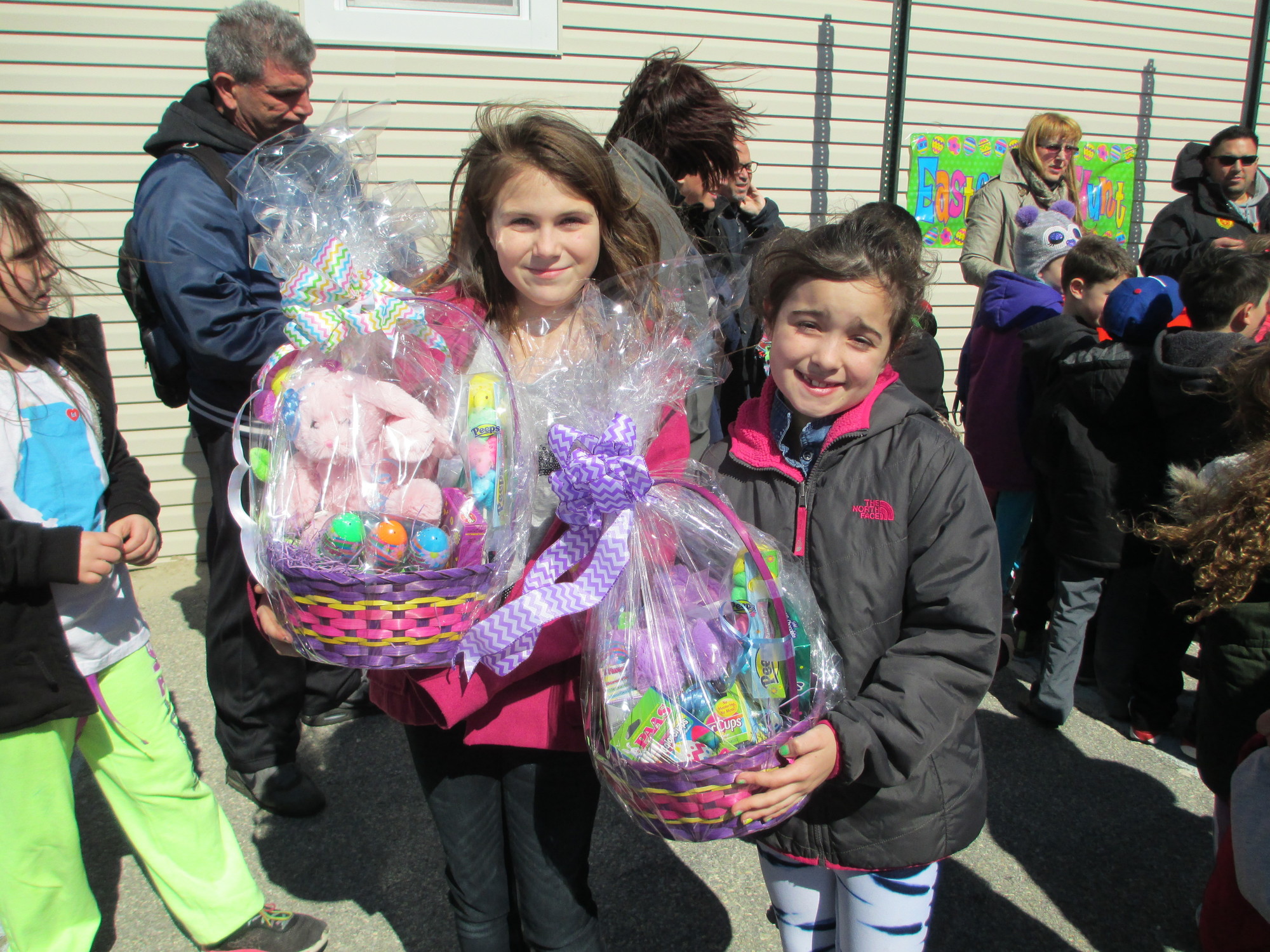 Fallon McCarthy and Kaitlin Griffin show off their baskets.