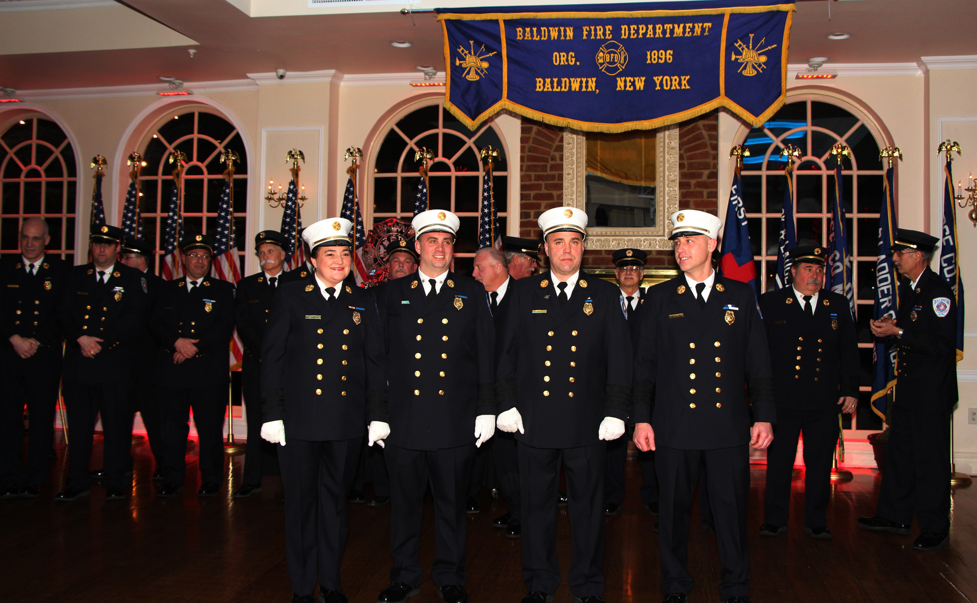 Karen Bendel, at left in front, was sworn in as the Baldwin Fire Department’s first female chief on March 28 during the organization’s 120th installation ceremony. Also, deputy chiefs, from left, Michael Jazylo (first), Frank Cesare (second) and Michael Esposito (third), took their oaths.