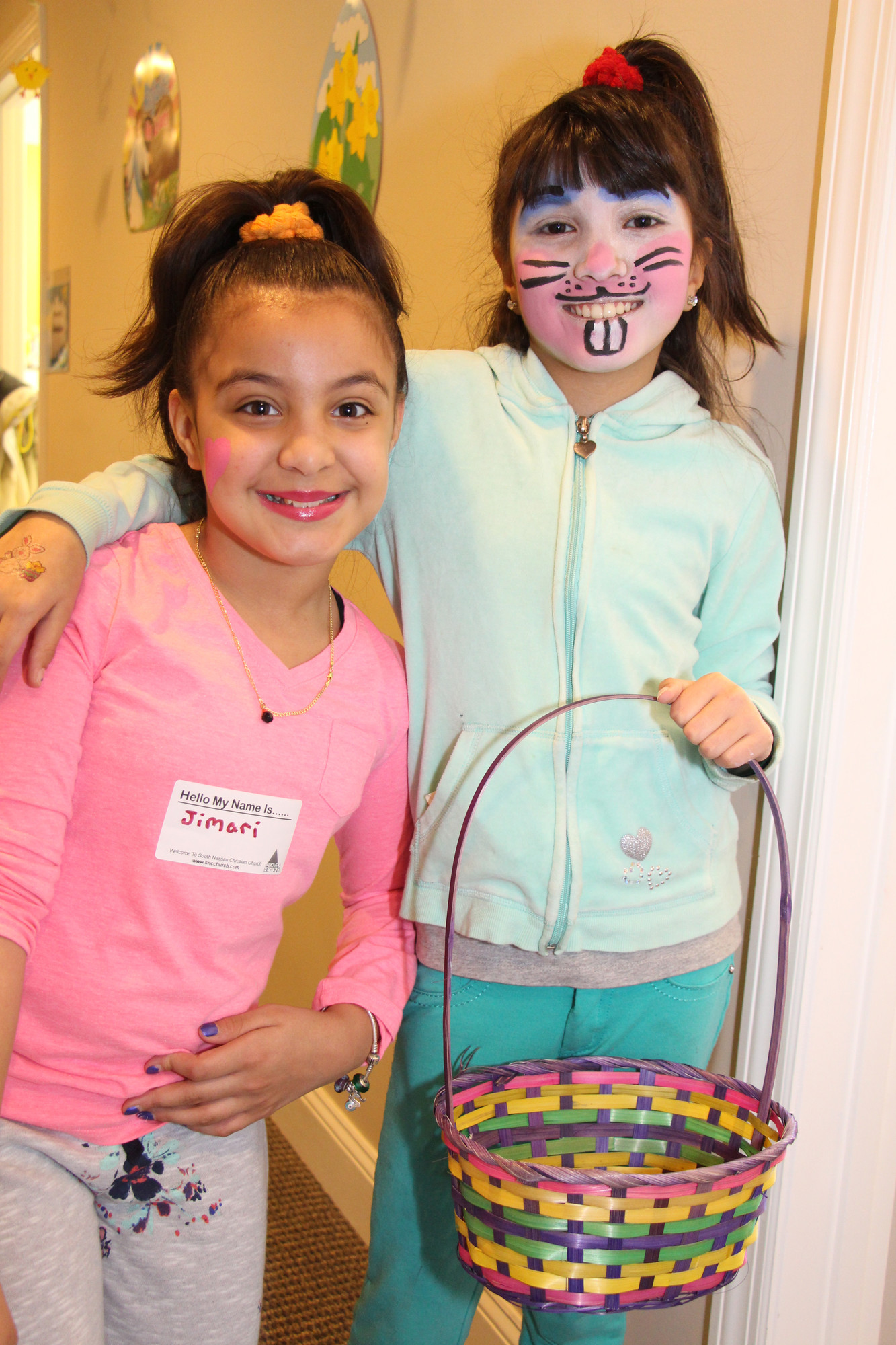 Jimari Velasquez, 10, left, and Ruby Maluik, 10, showed off their painted faces.