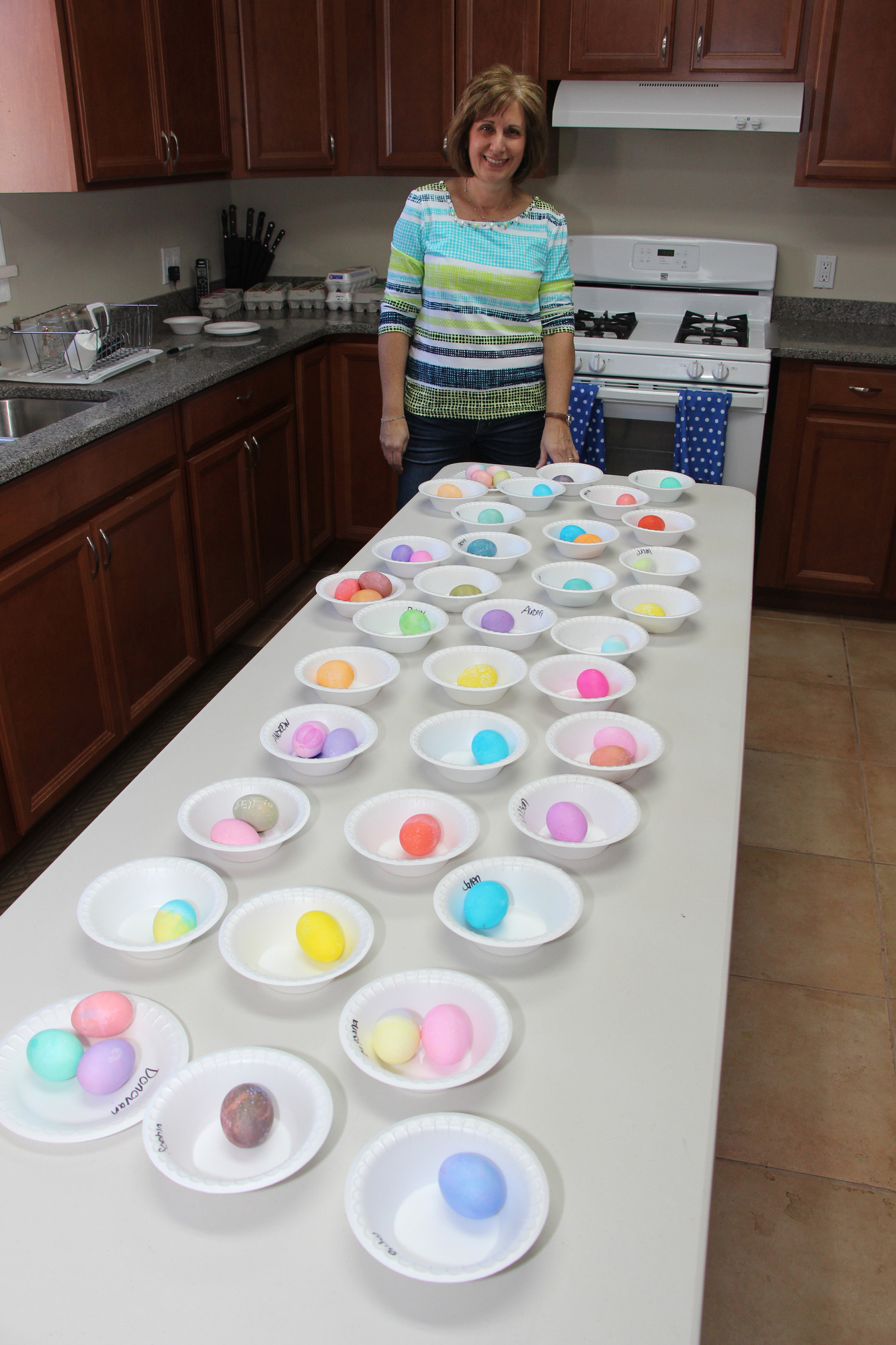 Jean Sharf, who helped coordinate many of the activities, looked over the colorful eggs the children made.