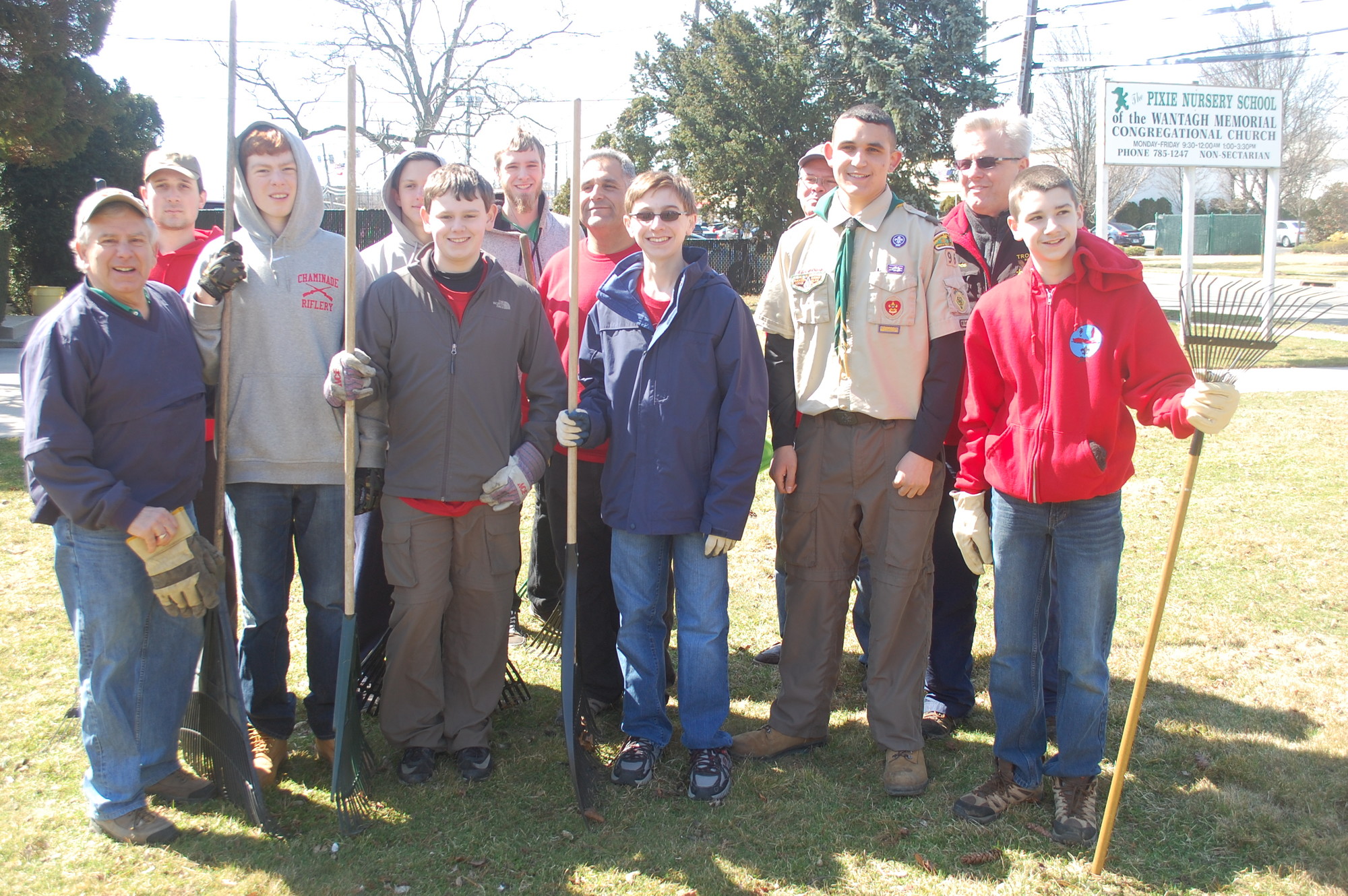 Stephen Vaiano, third from right, was joined by his volunteers for a cleanup of the grounds at the Wantagh Memorial Congregational Church on April 4.