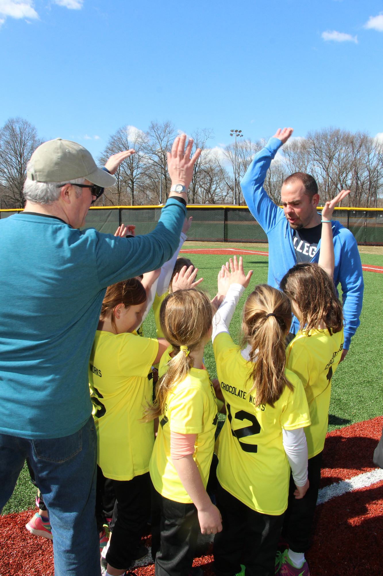 Coaches Brian Koluch, left, and Bob Bee got the Bumble Bees ready for their first game of the season.