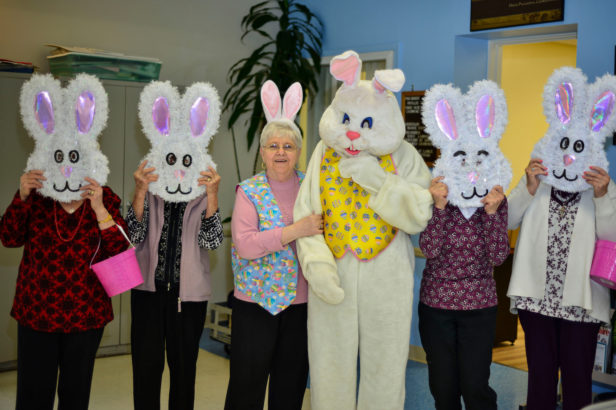 Phyllis Caggiano, third from the left, the membership president of the East Meadow Senior Center, along with Charlie Franza as the Easter Bunny, ignited the holiday spirit at the East Meadow Senior Center on April 8.