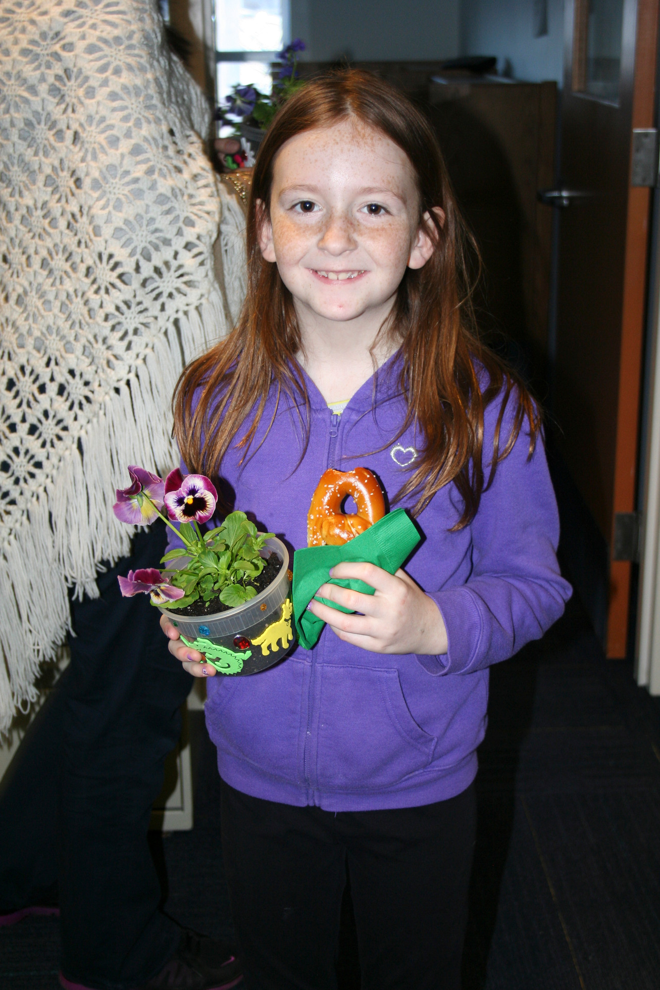 Colleen Reichel, 8, held her decked-out flowerpot and a yummy pretzel.