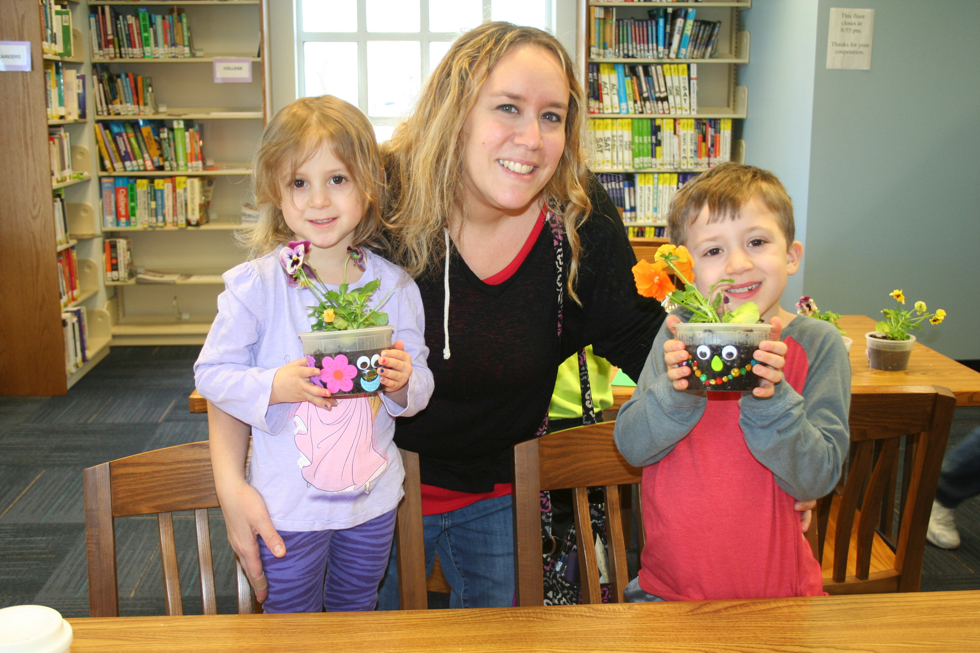 Melanie Wanger and her children, Violet, 4, and Skyler, 6, with their happy pansy pots.