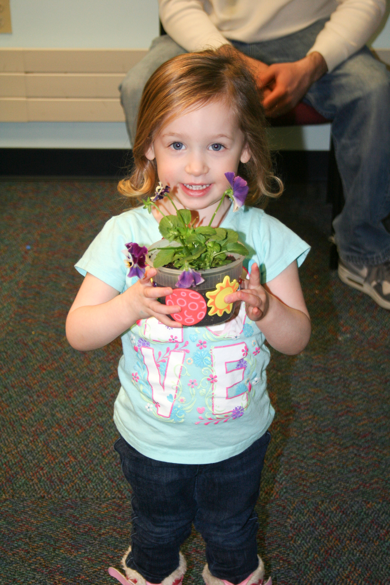 Ava Galati, 3, showed off her flower pot creation.