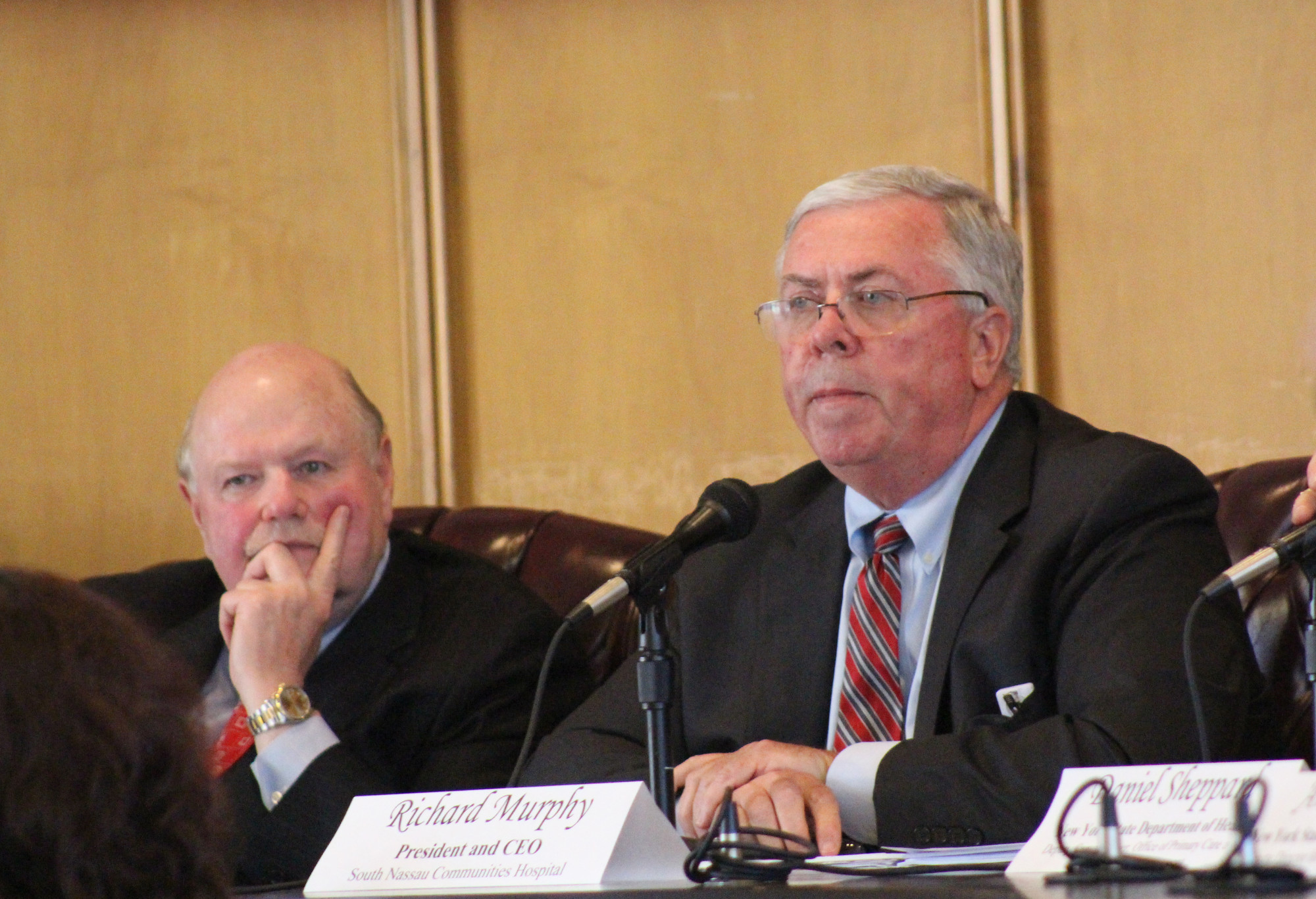 Joseph Fennessy, left, chairman of South Nassau's Board of Directors, and SNCH's President and CEO Richard Murphy listened to nearly 50 residents make their case for a full-service hospital in Long Beach.