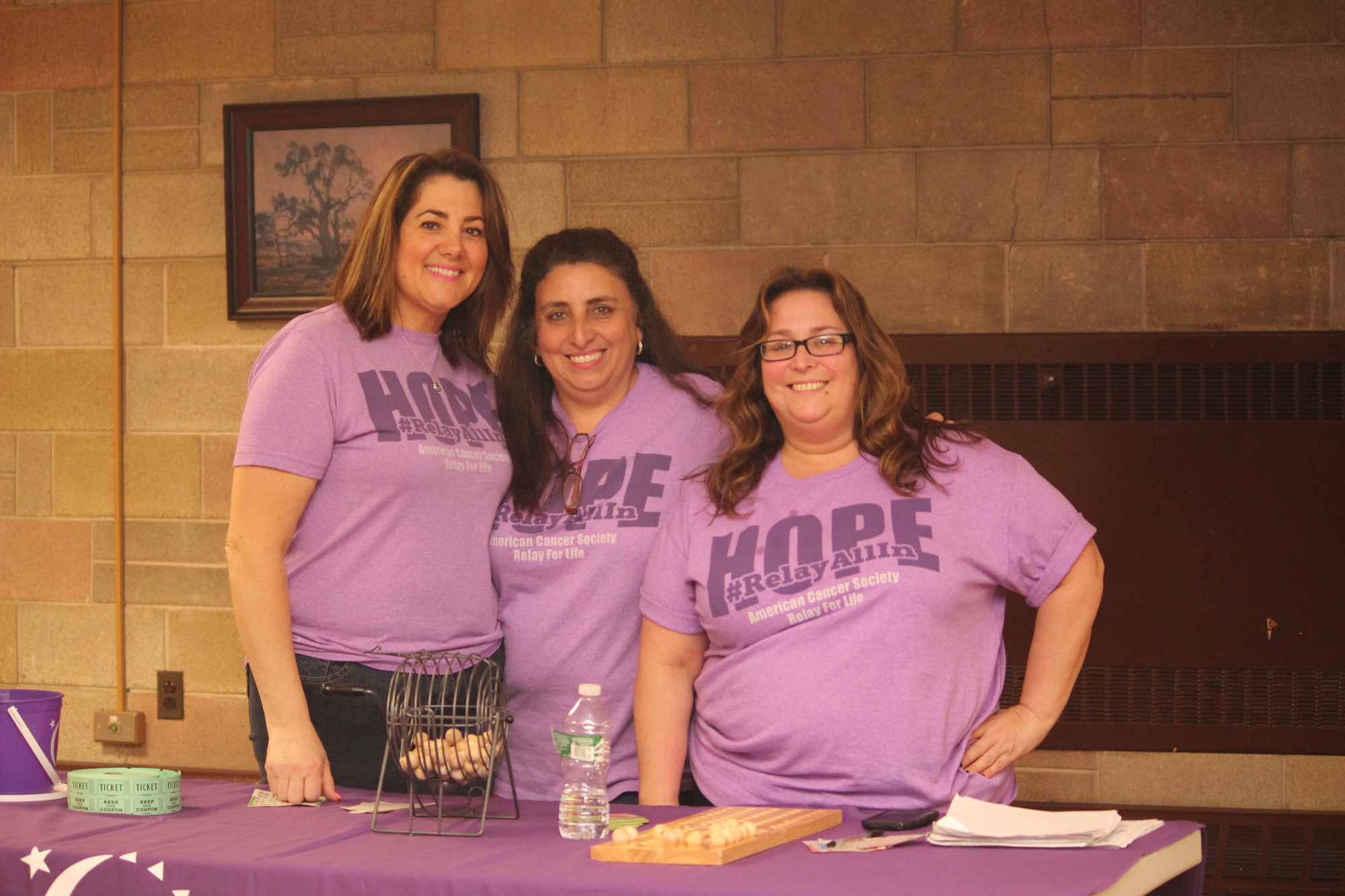 The tri-chairs of Team “Because We Care,” from left, Marie Burns, Renee Salmon, and Jennifer Scarduzio, volunteered at Relay For Life of Baldwin’s supermarket bingo event on April 10 at St. Christopher’s Church.