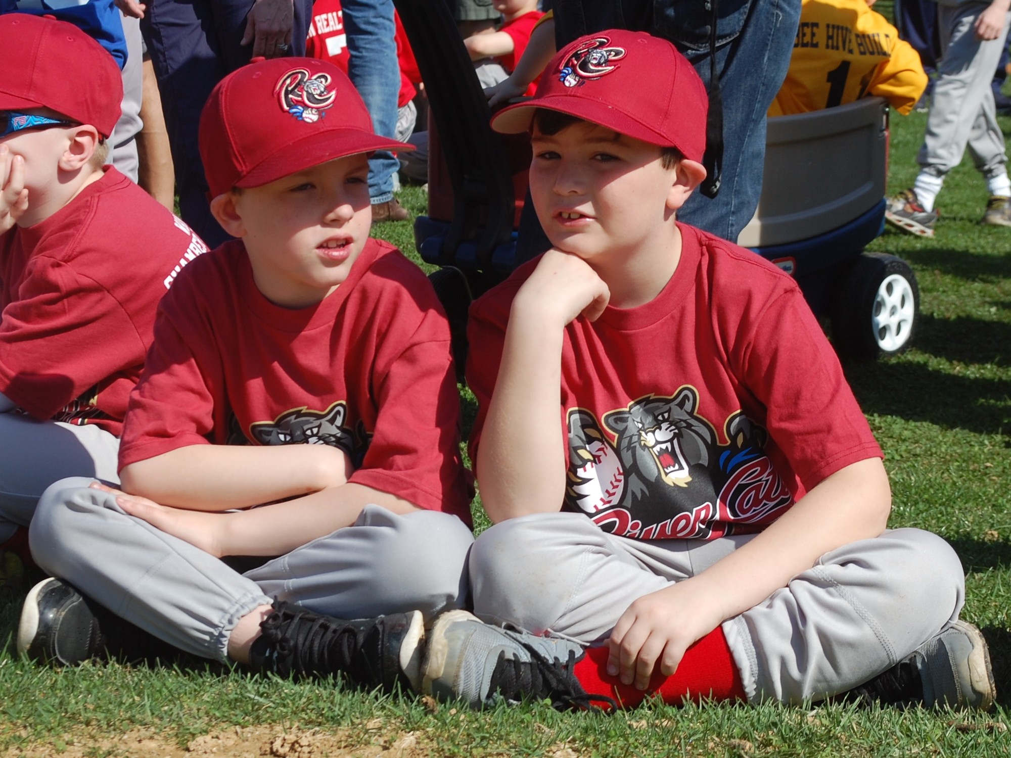Ryan McGlade, left, and Ben Wojcik, both 7 and players on the Wildcats, awaited the start of the Opening Day ceremony.