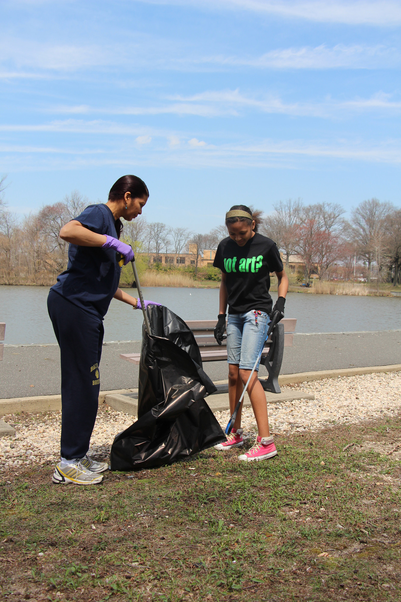 Colette Carrion and her daughter Nicolette, 13, helped out at Milburn Pond Park.