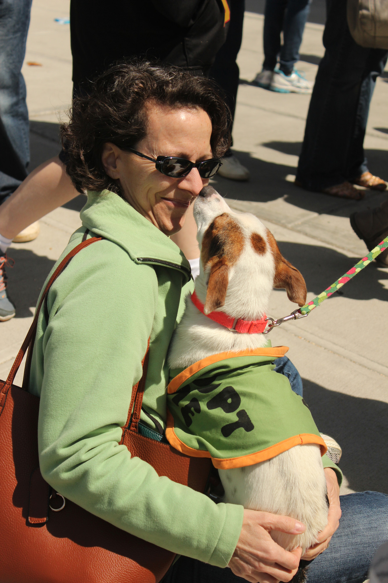 Temple member Leslie Eisenberg of Oceanside got a warm greeting from one of the rescue dogs up for adoption.
