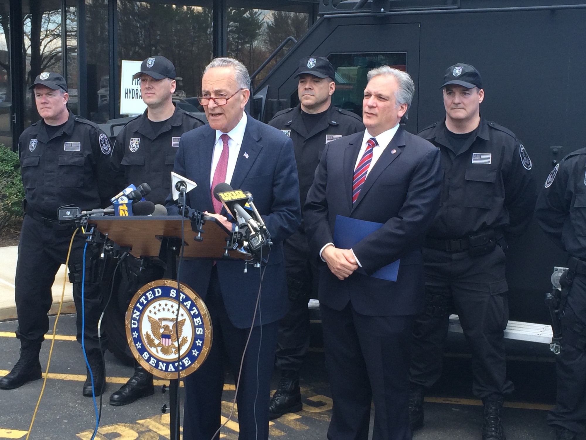 Senator Charles Schumer, at lectern, and Nassau County Executive Ed Mangano announced new legislation to combat "swatting” attacks at the federal level.