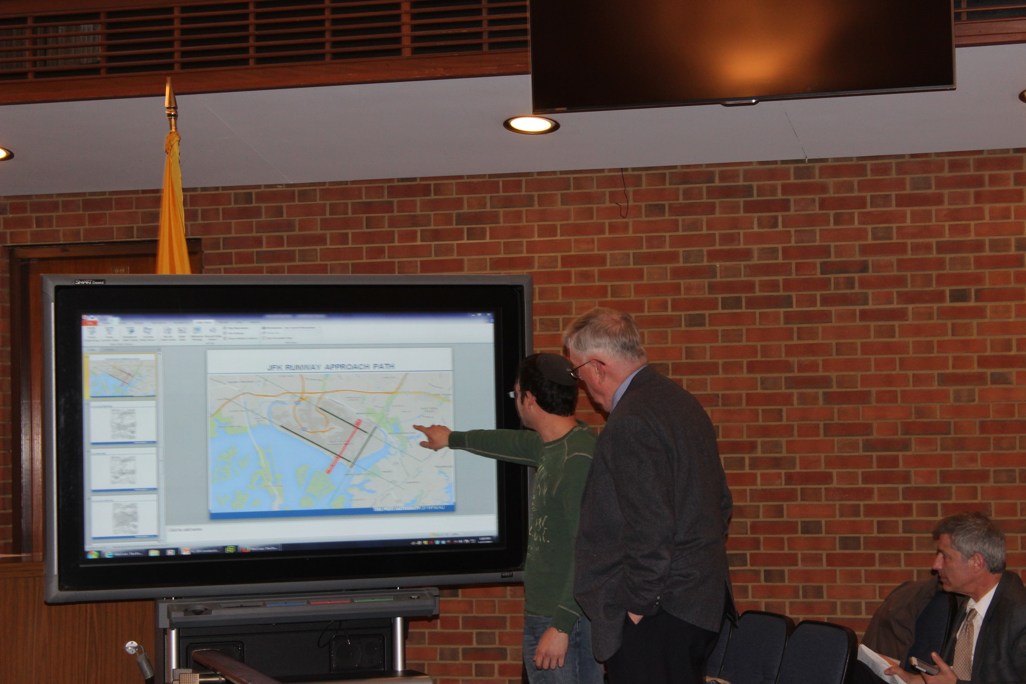 Residents complained about redirected flights and the noise generated by airplanes Above, at the TVASNAC meeting on Monday, Daniel Segall of North Woodmere, left, showed FAA spokesman Jim Peters, where the planes fly over his house.