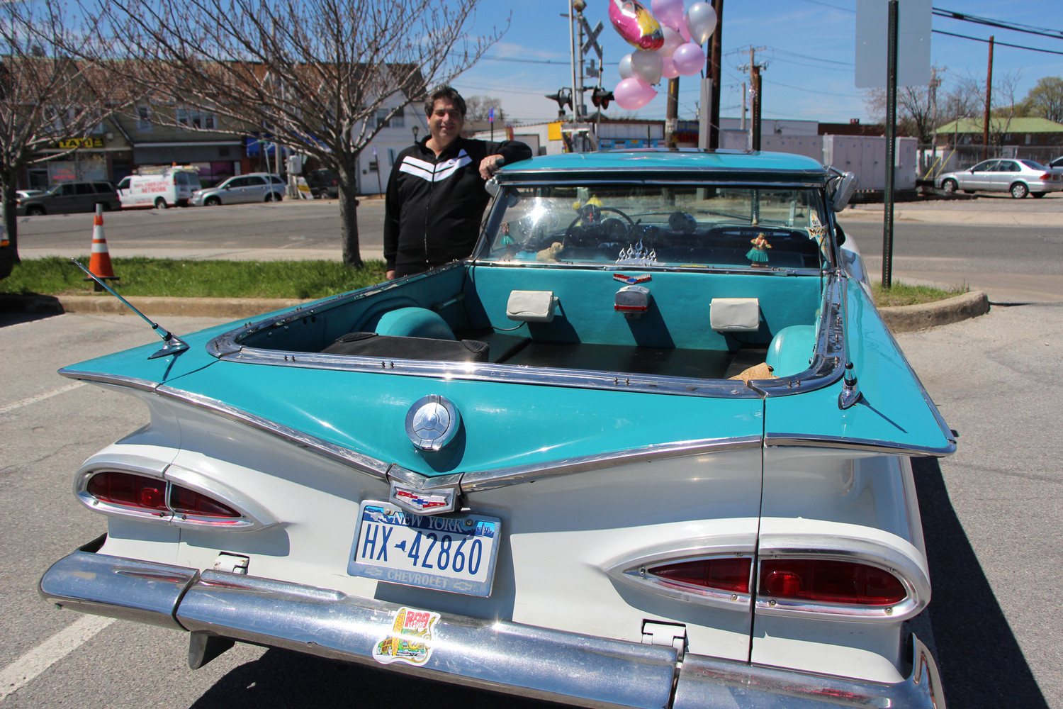 Dr. Wechsler of ROK Fitness, owner of the 1959 Chevy El Camino, orginal food tray with original speaker hanging from the window.