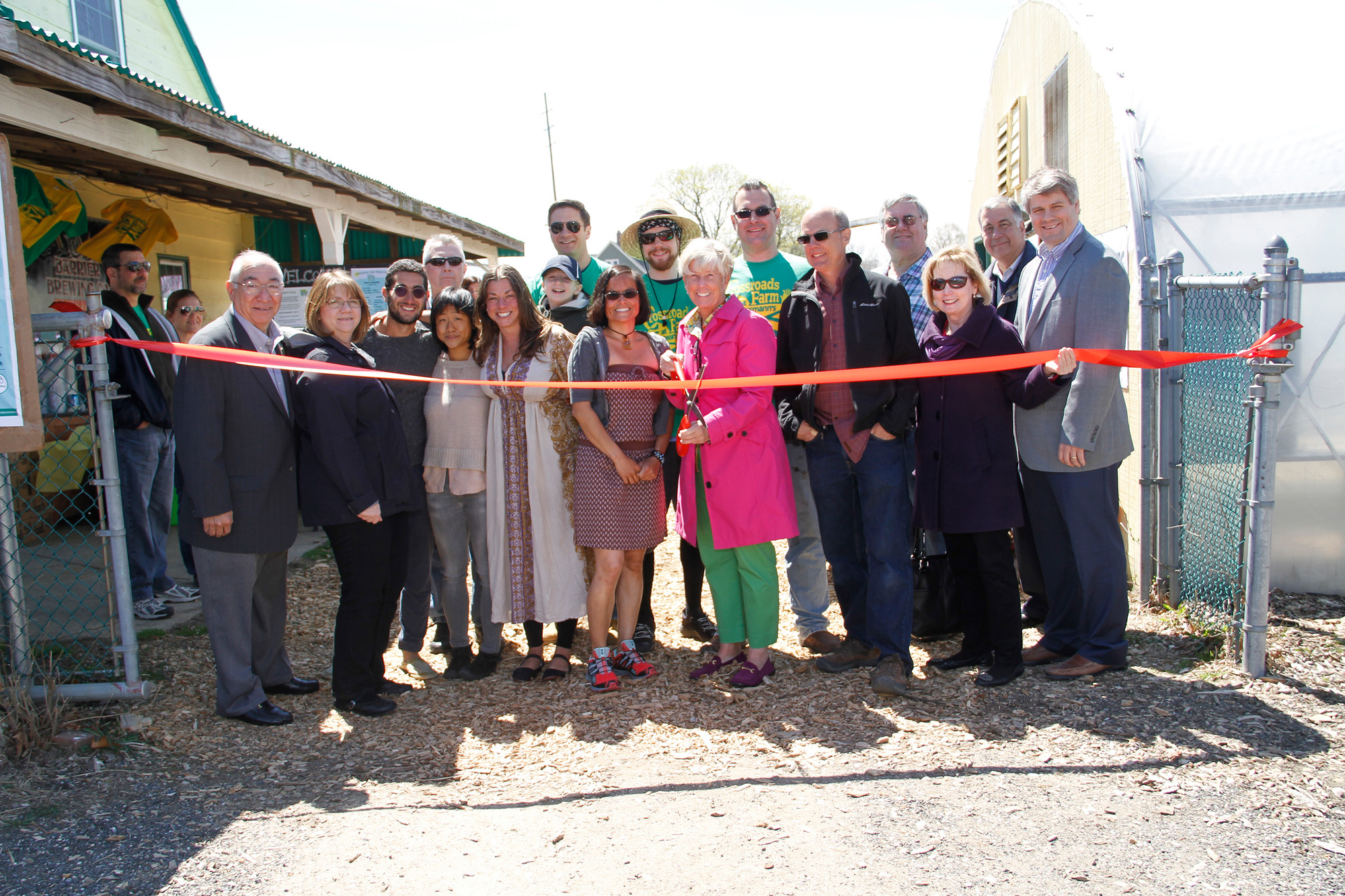 Mayor Patti McDonald, with village and farm VIPs, cut the ribbon on opening day.