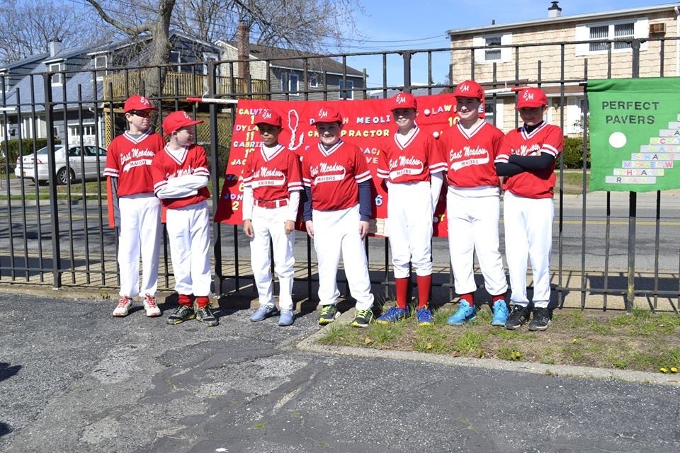 The players posed with their teammates in full uniform at last Saturday’s East Meadow Little League parade.