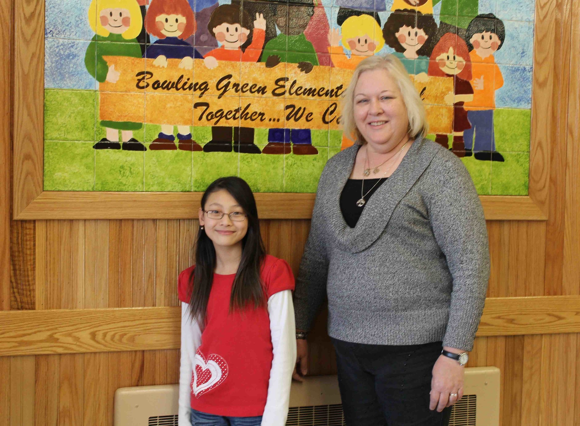 Yeonwoo Lee, with her Bowling Green Elementary School teacher Teresa Fjellstad, was a recent winner in the Town of Hempstead’s 2015 Recycle Poster Contest. Her artwork will be used to promote recycling townwide.
