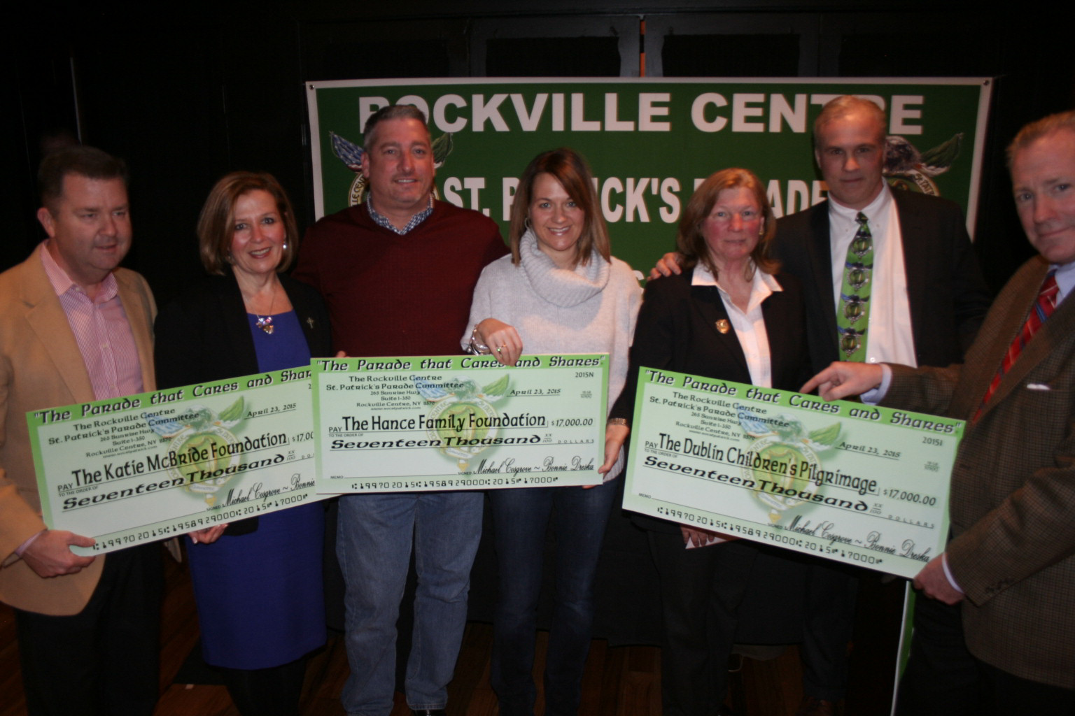 Mike and Jean McBride, left, Warren and Jackie Hance, Parade Committee Vice President Bonnie Dreska and President Mike Cosgrove and Niall Gunn with the $17,000 checks charities received from the St. Patrick’s Day Parade Committee.