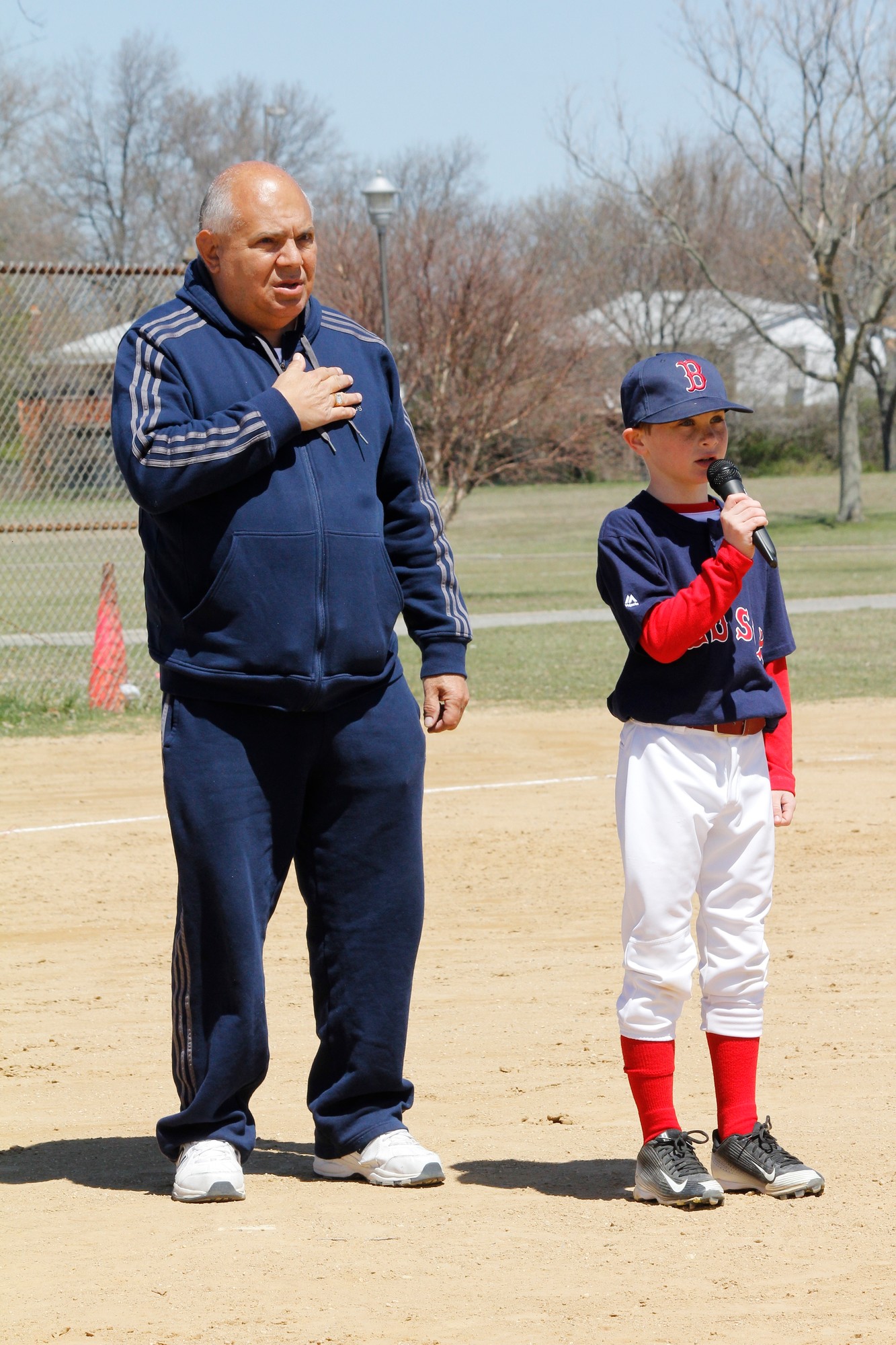 Sean Maddi, of the Red Sox, led the Pledge of Allegiance as Little League President Dee Cruz looked on.
