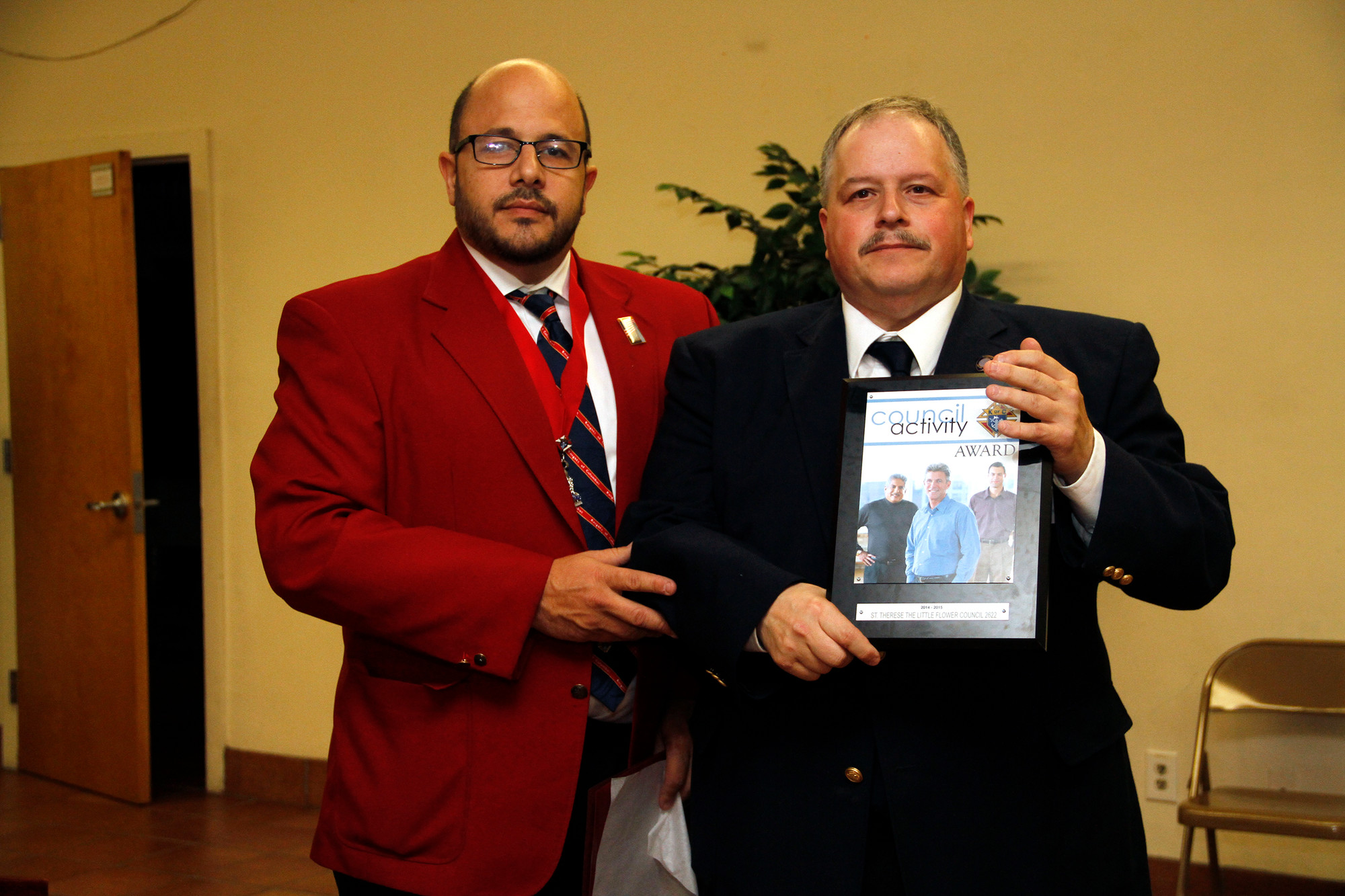 District Deputy Damiano Coraci, left, presented Grand Knight Larry Lombardo with the Council Activity award.