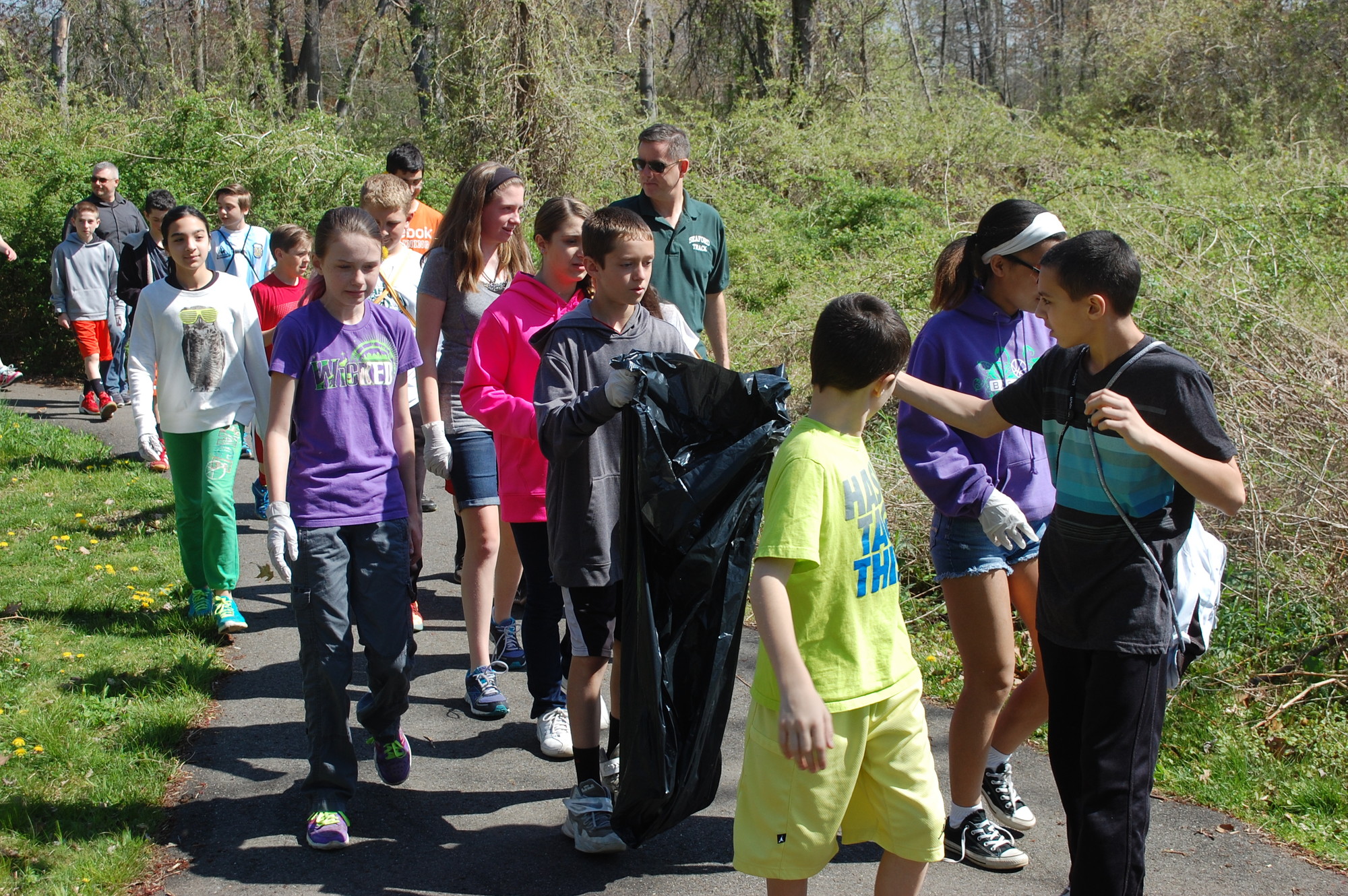 Seventh-graders from Seaford Middle School walked through the grounds of the Tackapausha Preserve on May 7 to clean up litter.