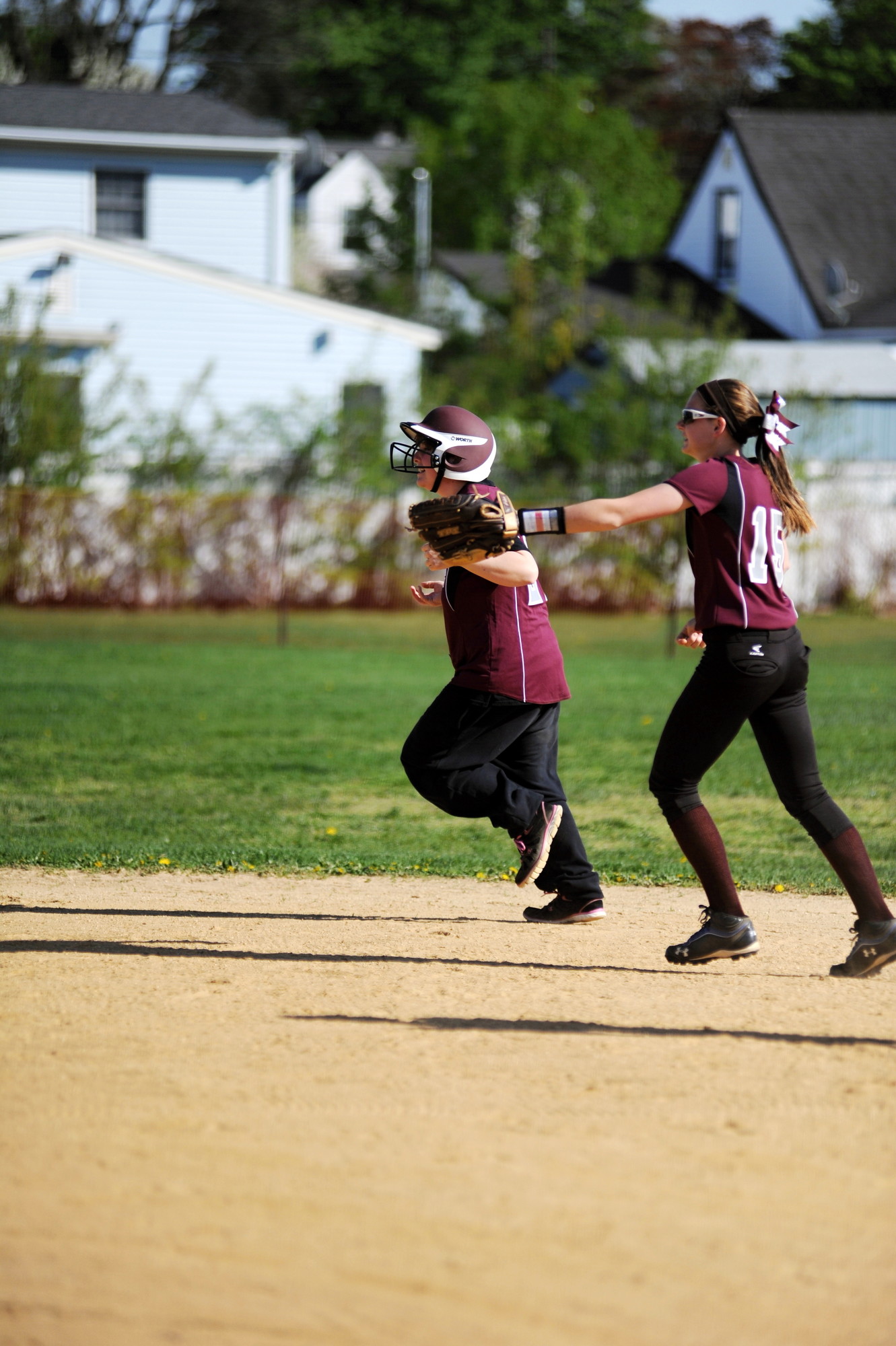 Teammate Kirstin Cox helped guide her as she rounded the bases.