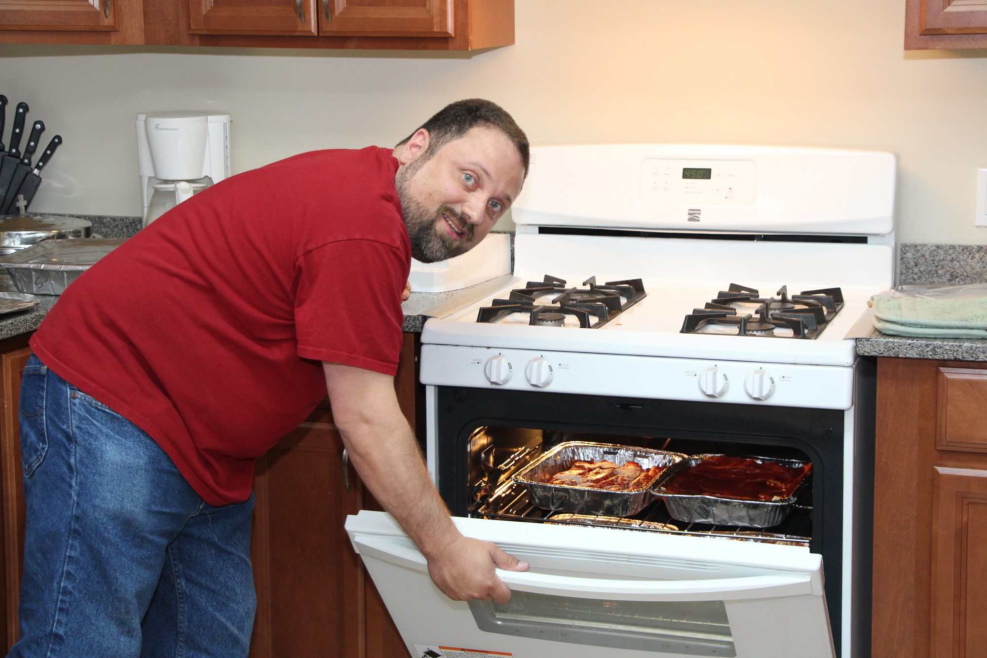 John Funaro checked out the oven to see if the food was hot enough for all the mothers in attendance.