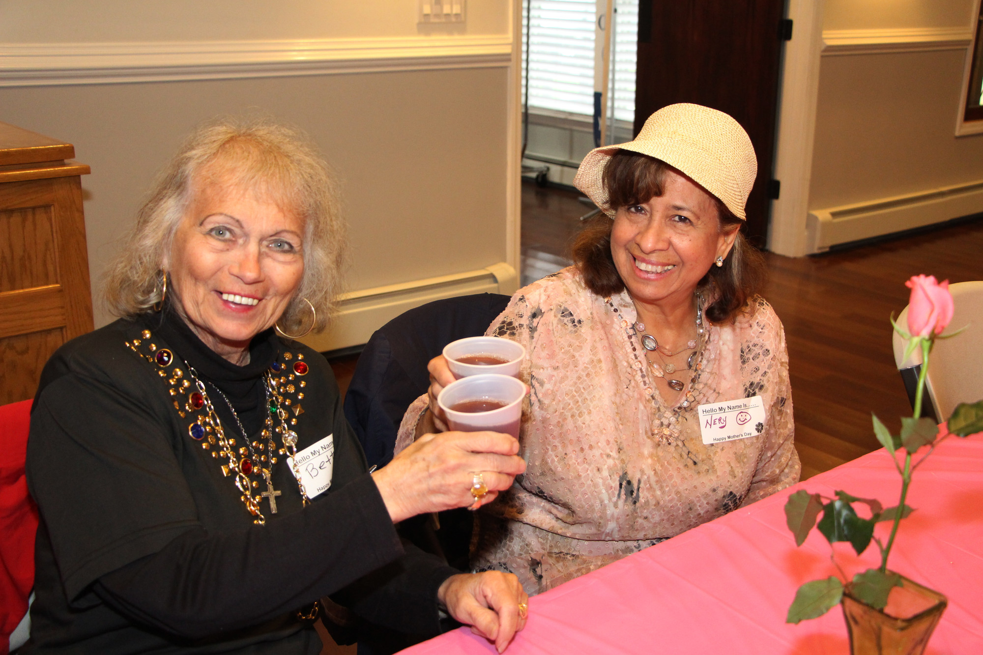 Betty Leionetti, left, and Nery Searra toasted for best wishes.