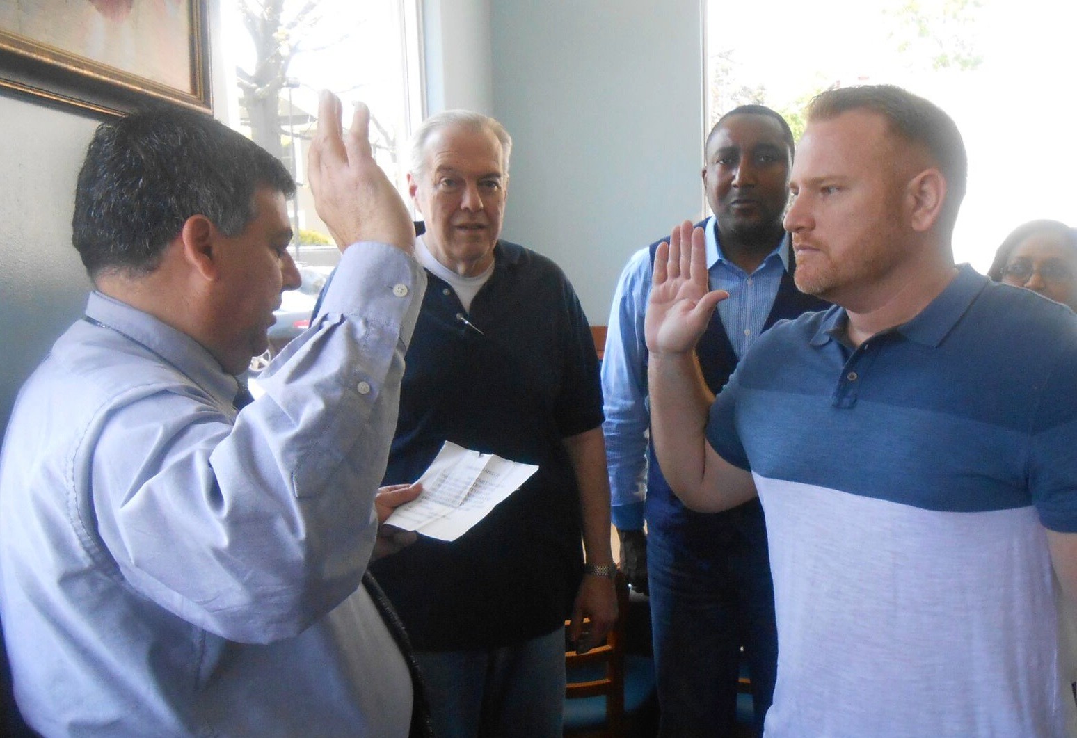 Mayor Bruno Romano, left, swore in new East Rockaway Chamber President Mike Hawksby at a meeting last Friday held at Villa Maria on Main Street. Chamber members Ken Clark and Carlton Williams looked on.