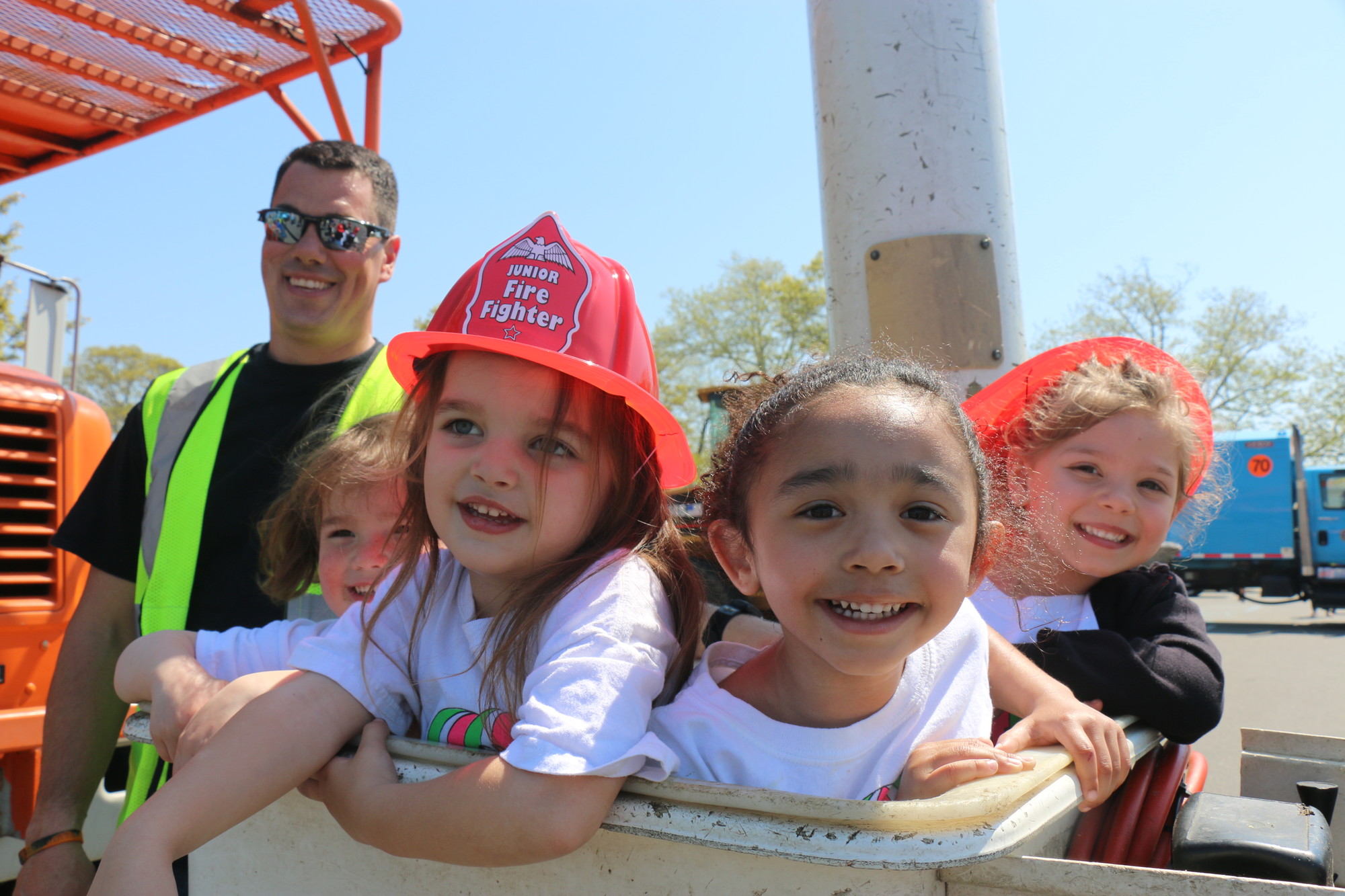 Hanging out out in the cherry picker were, from left, Briella DellItalia, 3; Emmy Manza, 3; Madeline Bitz, 4; and Mia Gilbride, 3. Behind them is village employee Joe Zuccaro.
