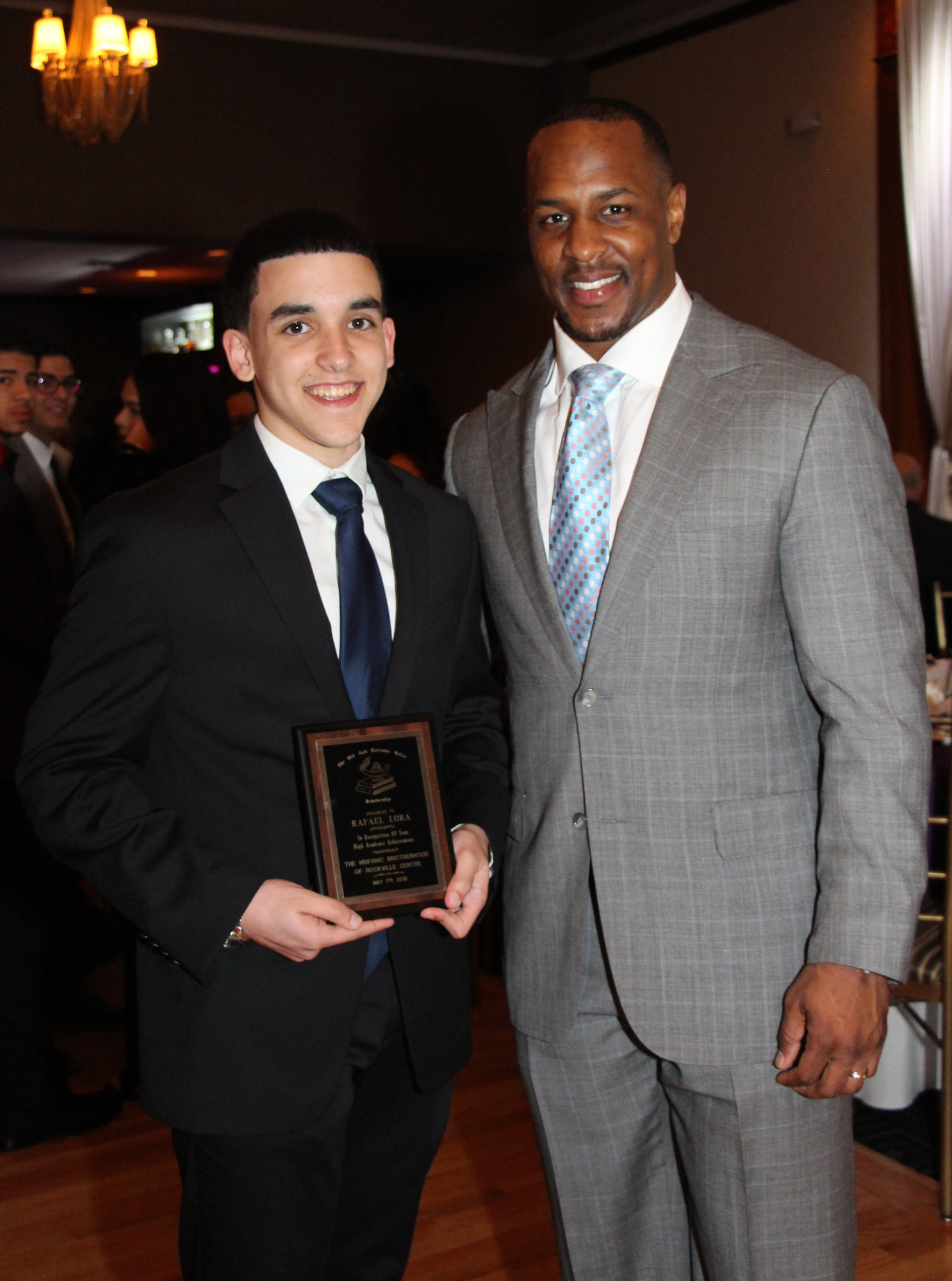 Scholarship winner Rafael Lora, left, with special quest Erik Coleman of the New York Jets.