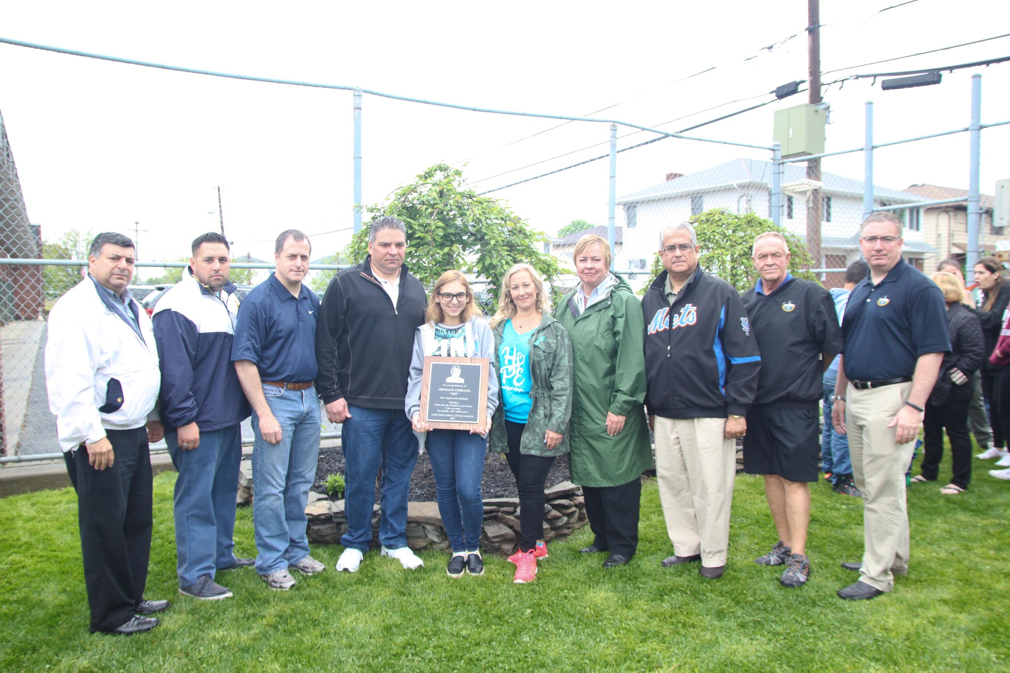 From left: East Rockaway Mayor Bruno Romano; Island Park Fire Chief Anthony D'Esposito, Assemblyman Brian Curran; John, Gianna, and Georgina Cipriano, Supervisor Kate Murray, Councilman Anthony Santino; and East Rockaway Trustees Steve Fried and Rich Bilello.