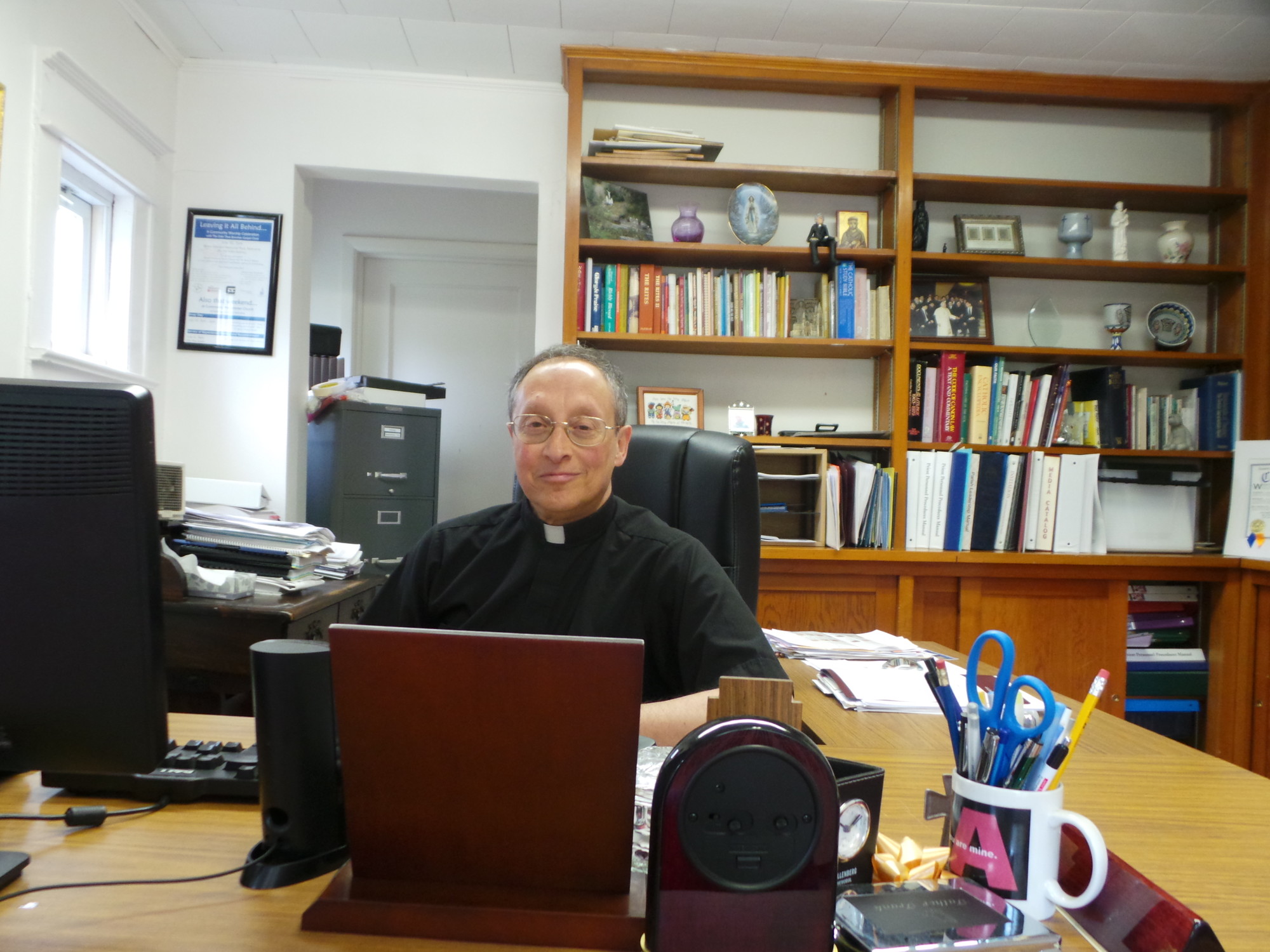 Father Frank Parisi in his office at Our Lady of Lourdes last week.