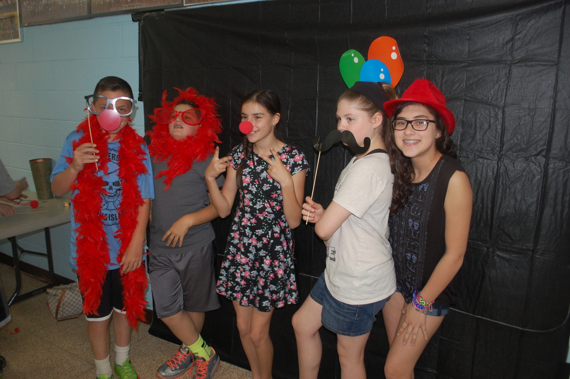 Wantagh Middle School students used props to take comical pictures as a fundraiser for Red Nose Day on May 21.