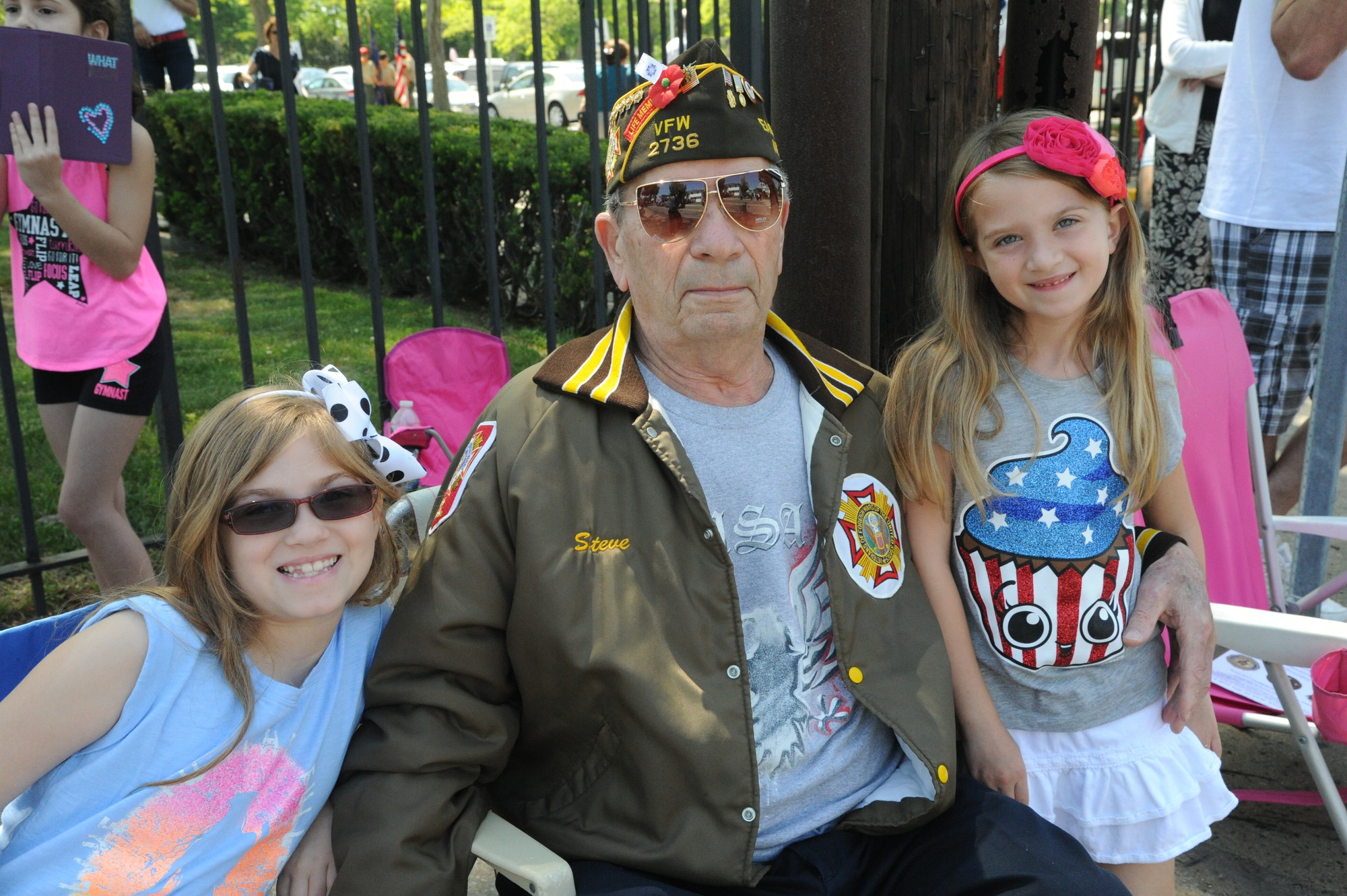 Steve Grismondi, a Private First Class of the U.S. Army in the Korean War, with his granddaughters, Brianna, 8, and Kayla, 6.