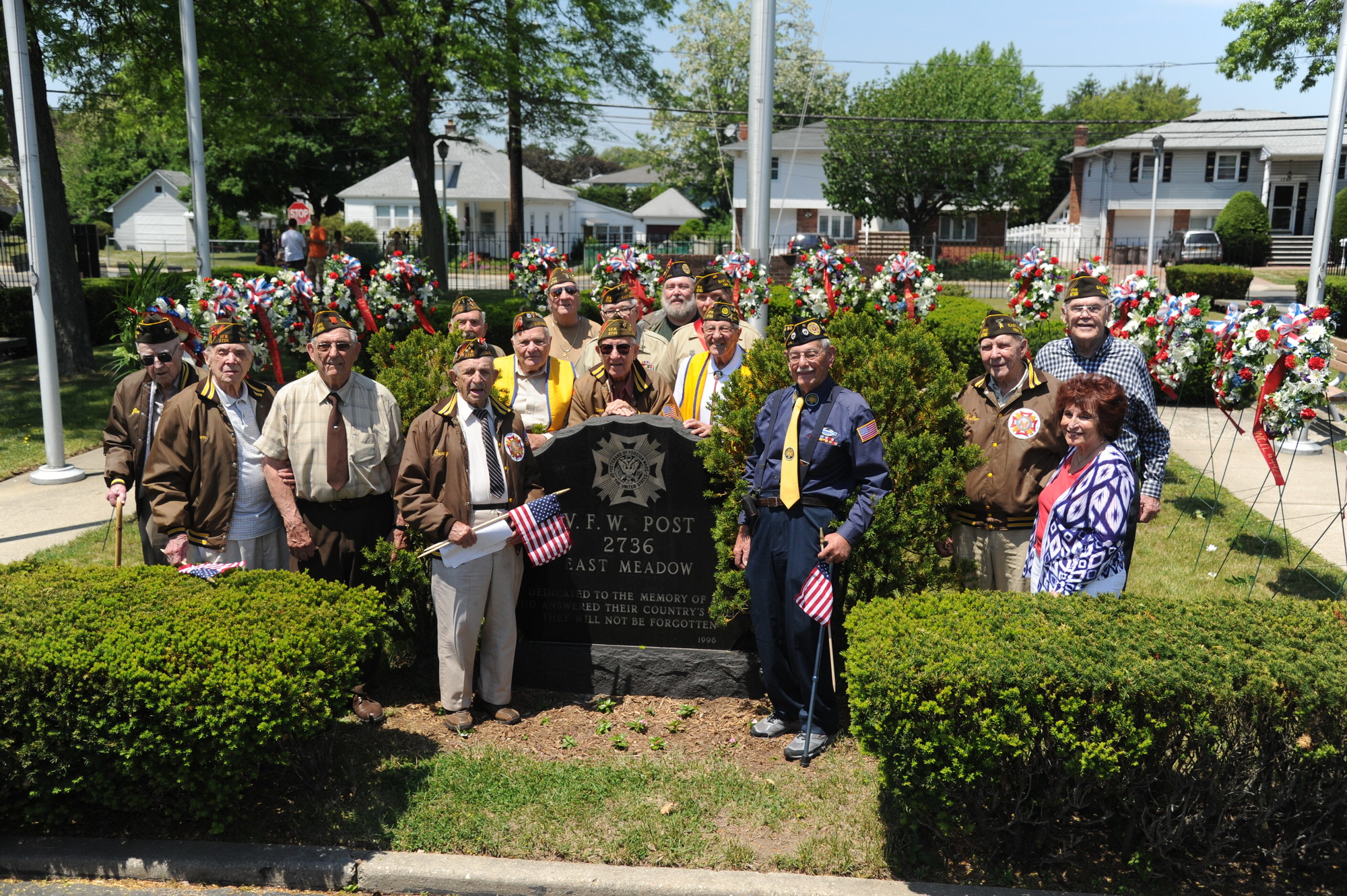 Members of East Meadow Veterans of Foreign War Post 2736 gathered in Veterans Memorial Park after Monday’s Memorial Day parade, at which thousands of community members honored servicemen and women who died defending the United States.