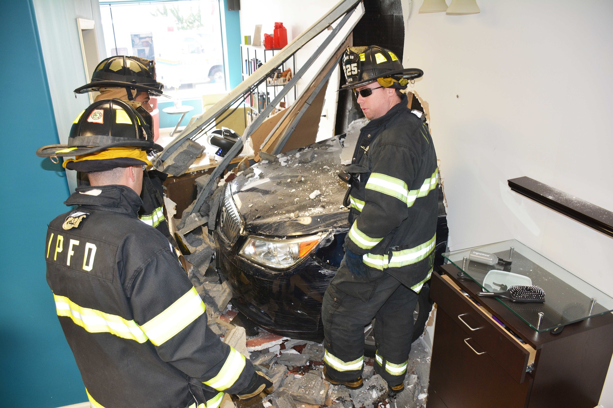 Island Park FD responded to a car driven into the side of the Vivo Salon in Island Park.
