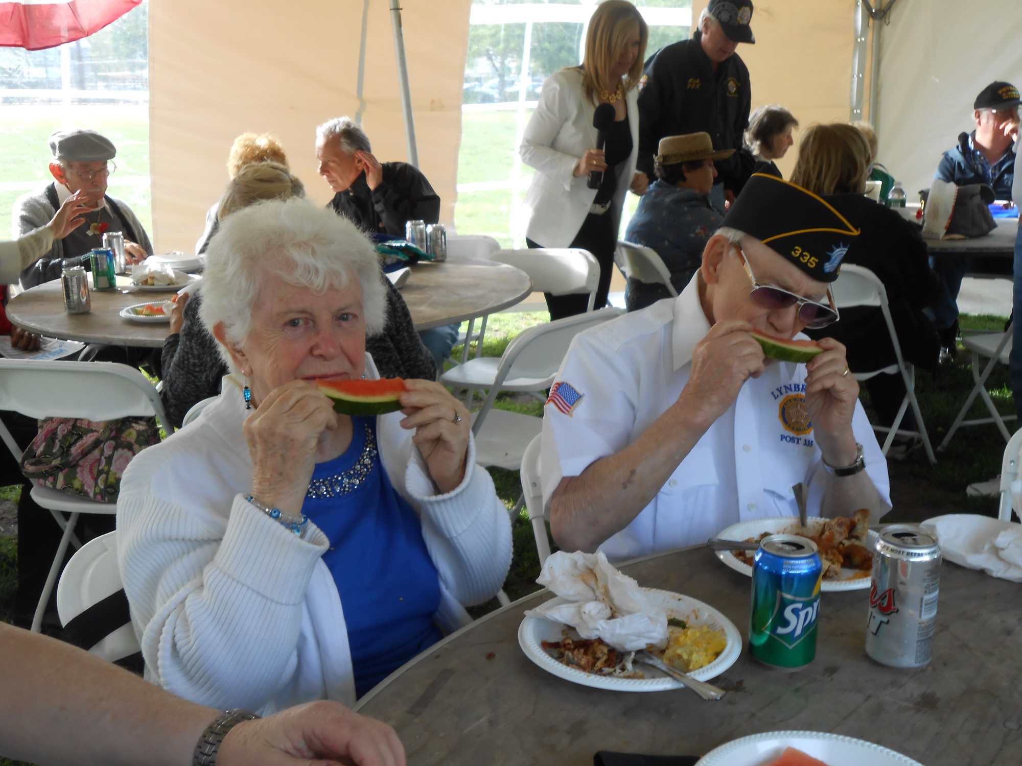 Maureen and John Zachmann, of Lynbrook, enjoyed their juicy slices of watermelon under the VIP veteran tent.
