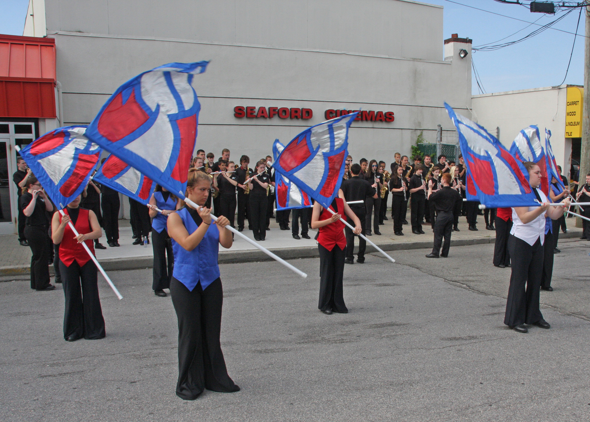 The Seaford High School Marching Band's color guard performs in the parade.