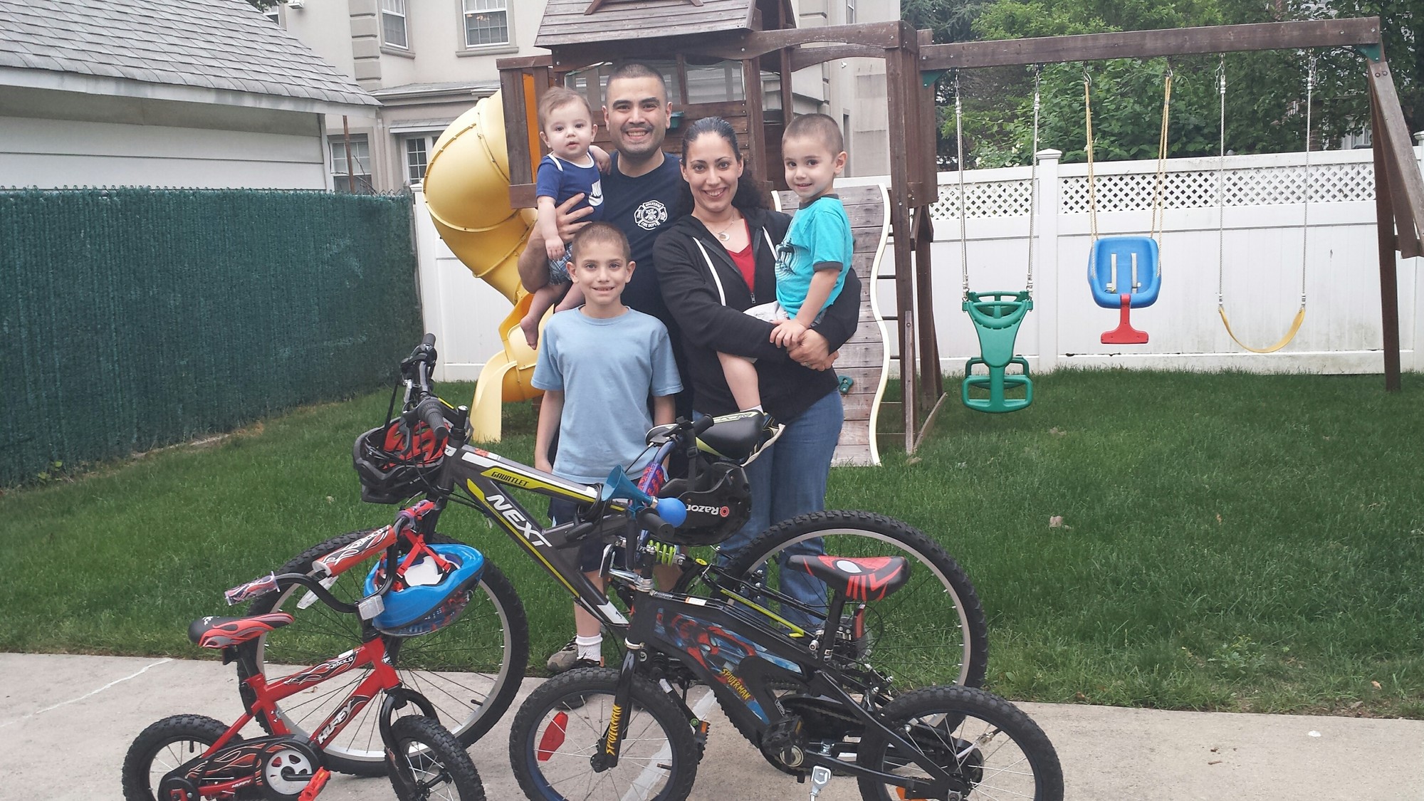 The Huertas family is ready for the Tour de Cure, an American Diabetes Association fundraiser. Malverne Building Department Superintendent Ausberto Huertas with his wife, Dena, and their sons, Gavin, standing, Nathaniel, in Dena’s arms, and Brendan.
