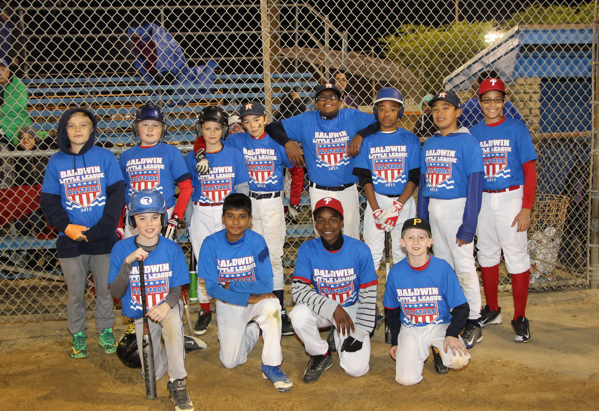 Baldwin Little League All-Stars faced off on May 23 at Baldwin Park. Pictured were 11 and 12 years olds on the blue team who gathered before taking the field.