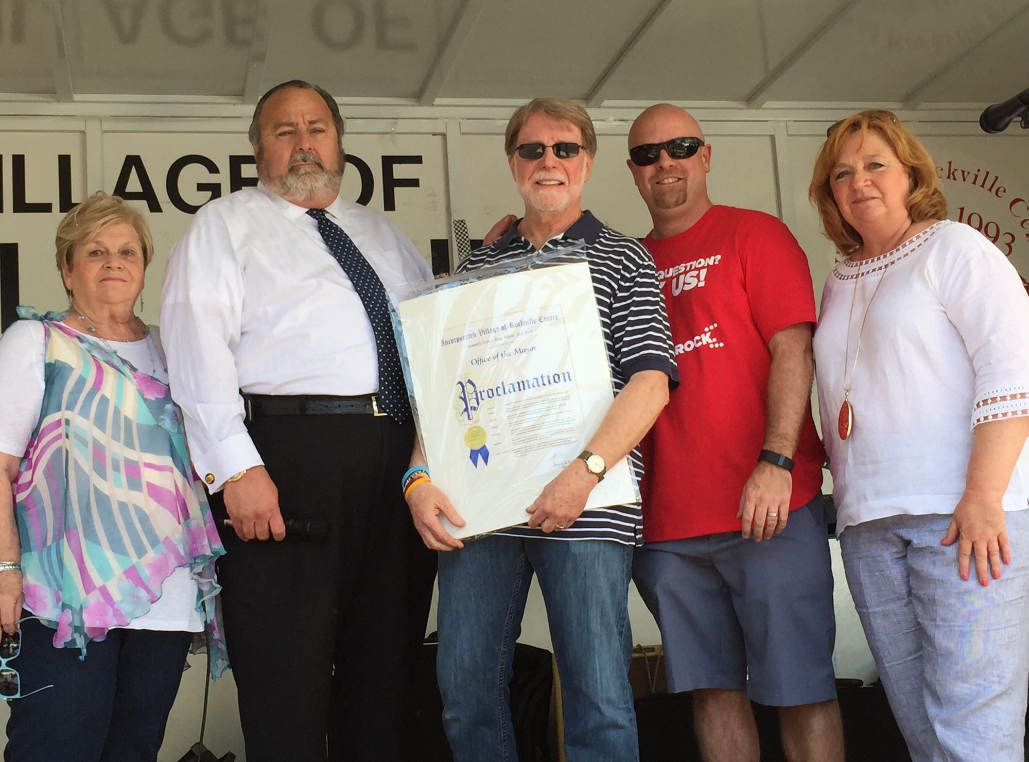 Jess Resnick, center, accepted a proclamation honoring his wife, Karen, from Chamber President Barbara Goldfeder, left, Mayor Francis X. Murray, Chamber Vice President Greg Schaefer and Deputy Mayor Nancy Howard.