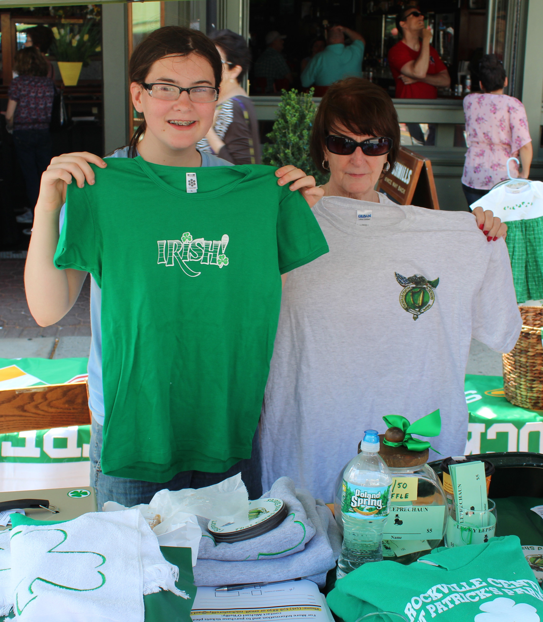 Caroline Cosgrove, left, and Kathy Collins sold merchandise to raise money for the Rockville Centre St. Patrick’s Parade.