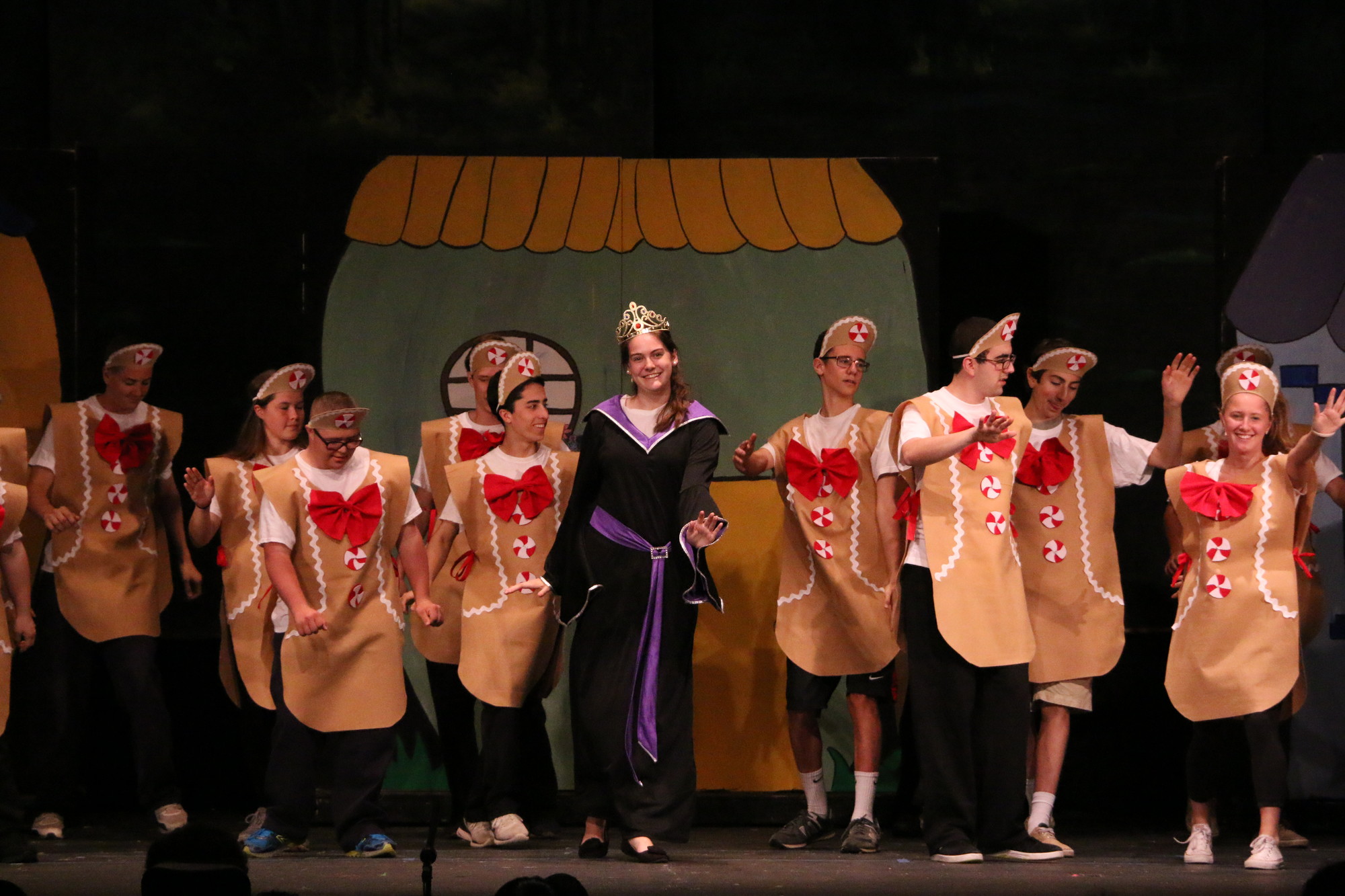 The evil Witch, played by Brigid Farrell, center, with her group of gingerbread people. From left are John O’Brien, Allie Barry, Connor Barry, Ryan Coughlin, Chris Chiechi, Campion Quinn, Alex Stamboulidis and Megan Harkins.
