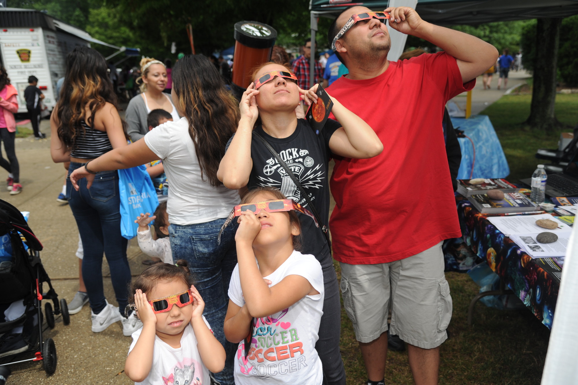 Nicole and Allison Garcia, and their parents Sandra and Walter, viewed the sky from a brand new perspective while at the booth for the Amateur Observers Society of New York.