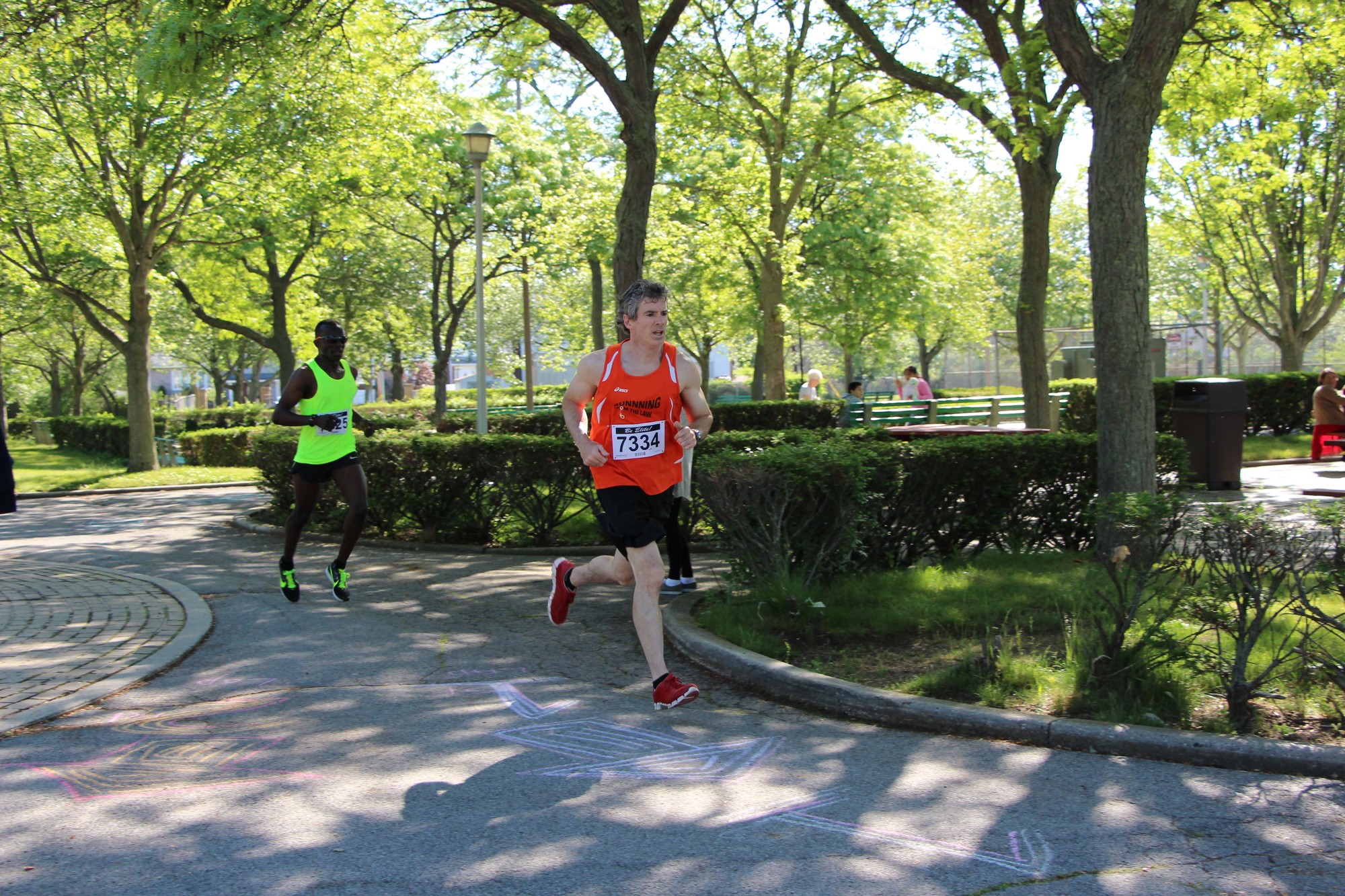 The pace was fast for second-place finisher Keith Guilfoyle, right, and Mwangi Gitahi close behind.